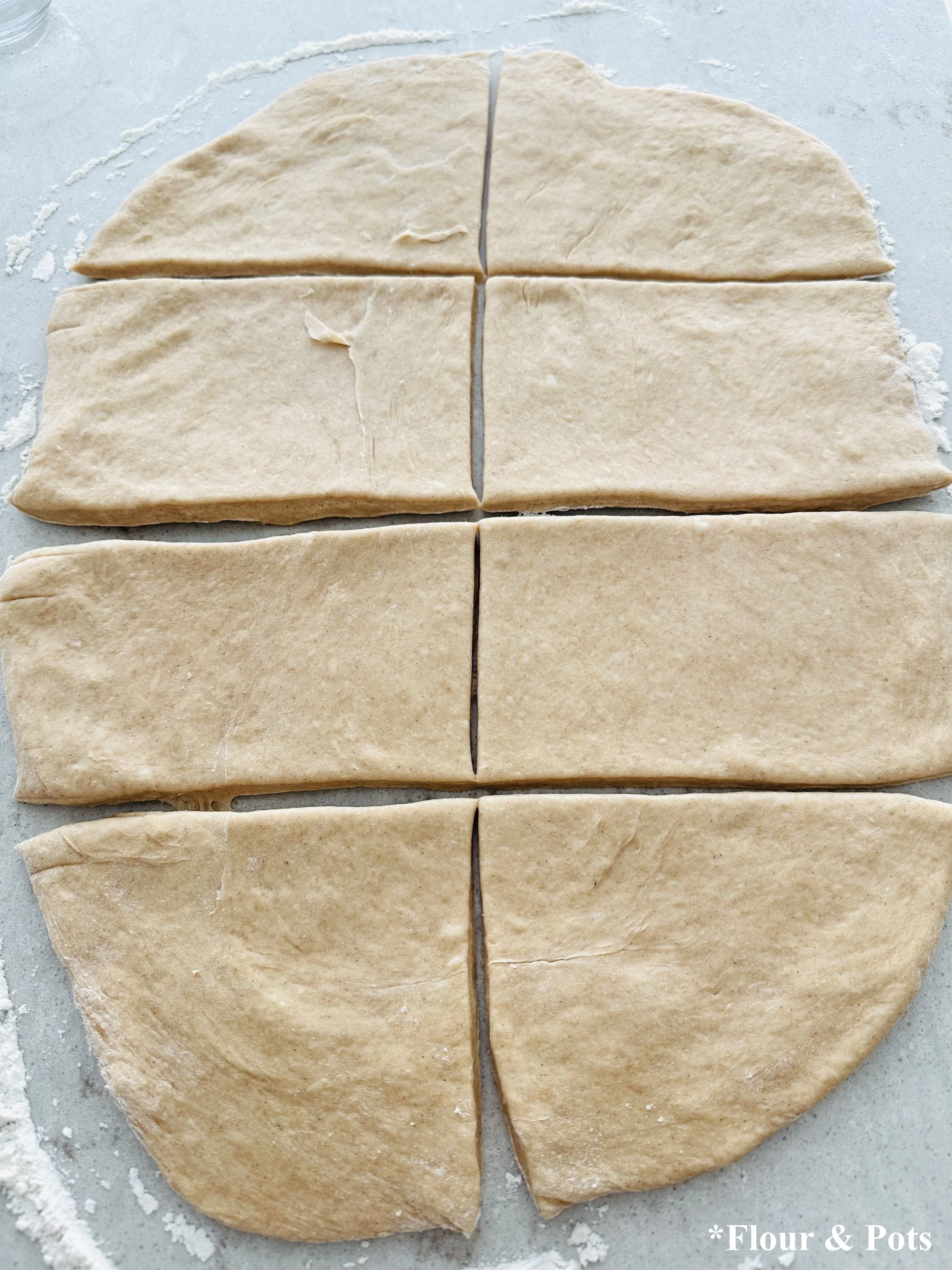 Bread dough rolled out and cut into 8 pieces