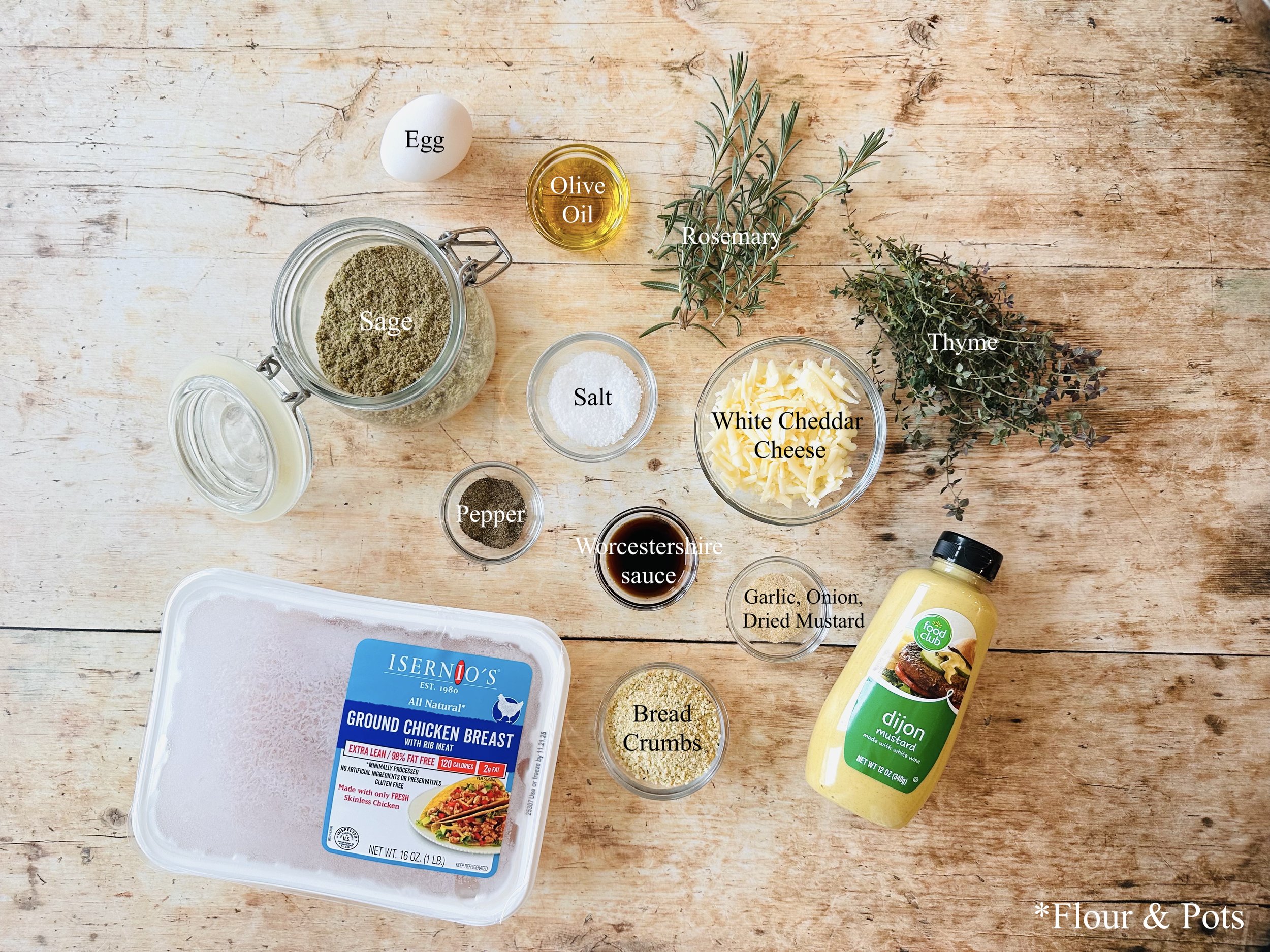 Fresh herbs, bread crumbs, cheese, and seasonings for baked chicken meatballs.