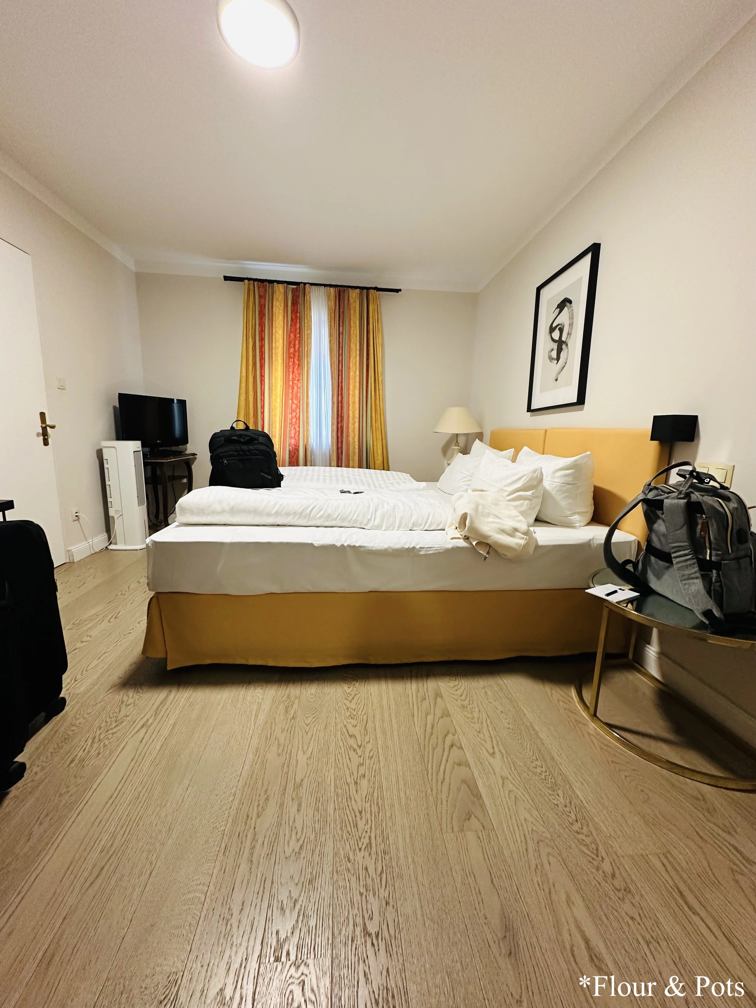 Cozy hotel room at Eisenhut Hotel in Rothenburg, Germany, featuring traditional decor and comfortable furnishings.