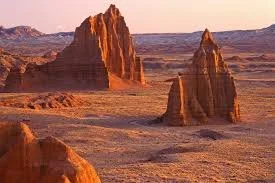 Desert landscape with large rock formations at sunset