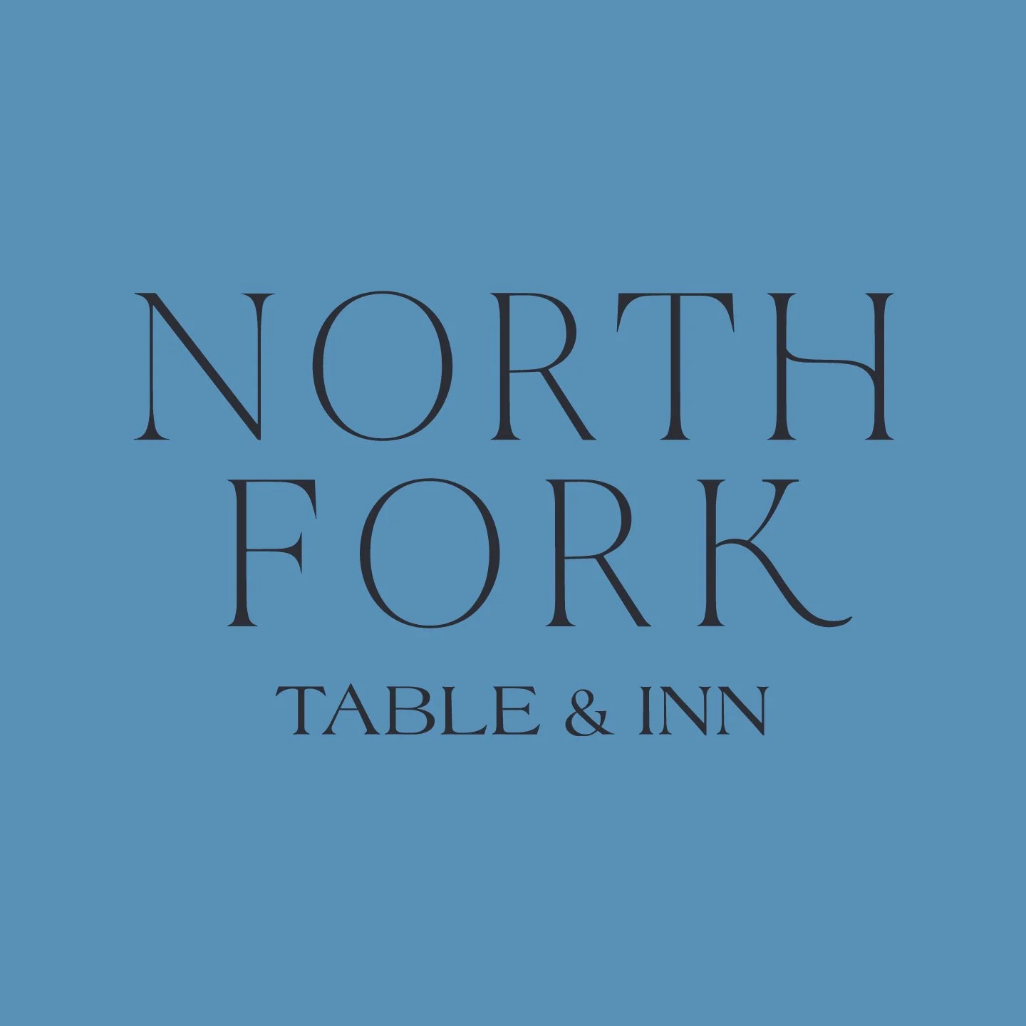 Blue sign with the text 'North Fork Table & Inn' in black lettering.