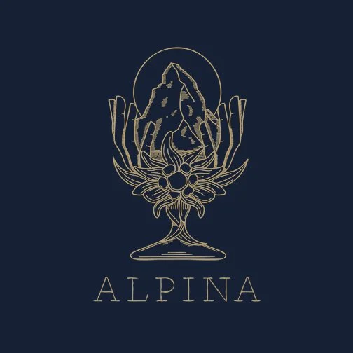 A gold line drawing of a mountain in a chalice, with floral elements and a full moon, and the word 'ALPINA' underneath on a dark background.