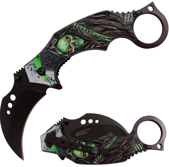 A pair of butterfly knives with black handles and green skull artwork on the blades.