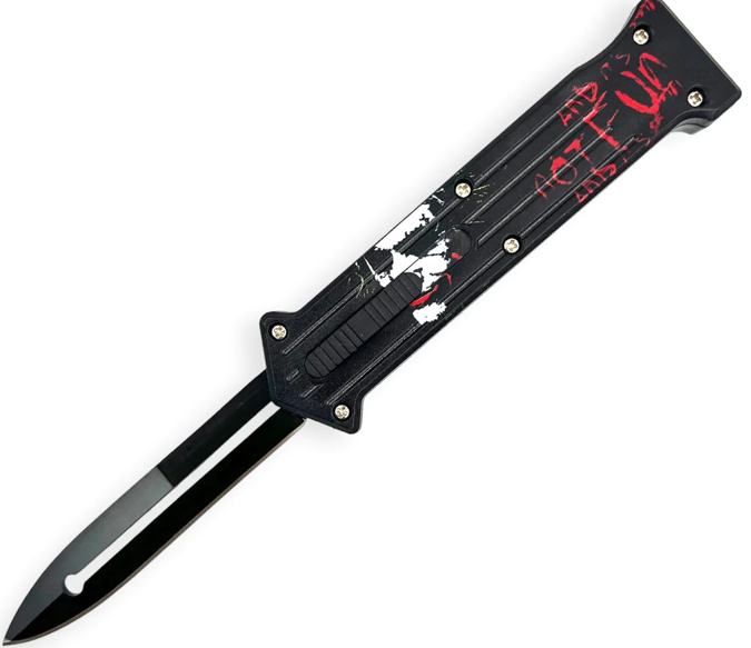 A black switchblade with a partially serrated blade and a decorative handle featuring red and white graphics.