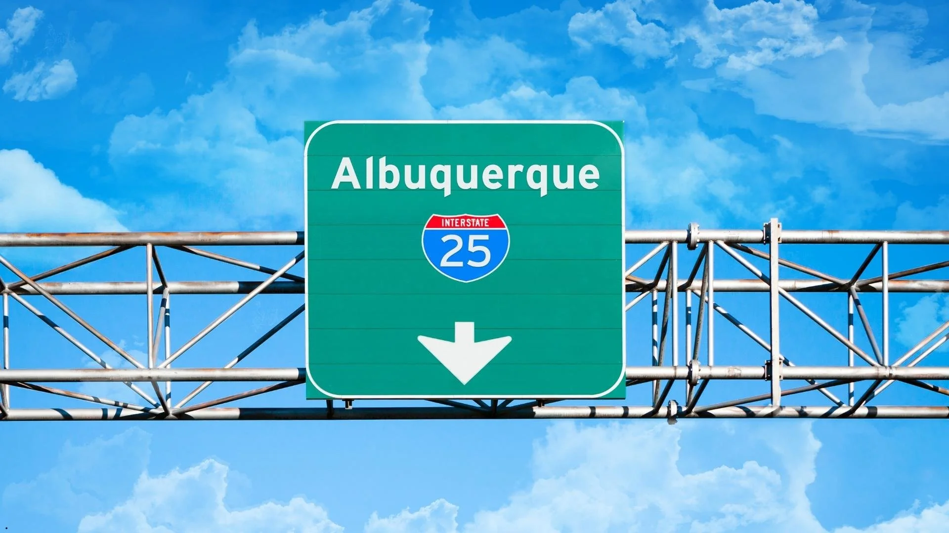 Interstate 25 freeway sign in Albuquerque NM, starting point for a New Mexico travel trailer rental road trip.