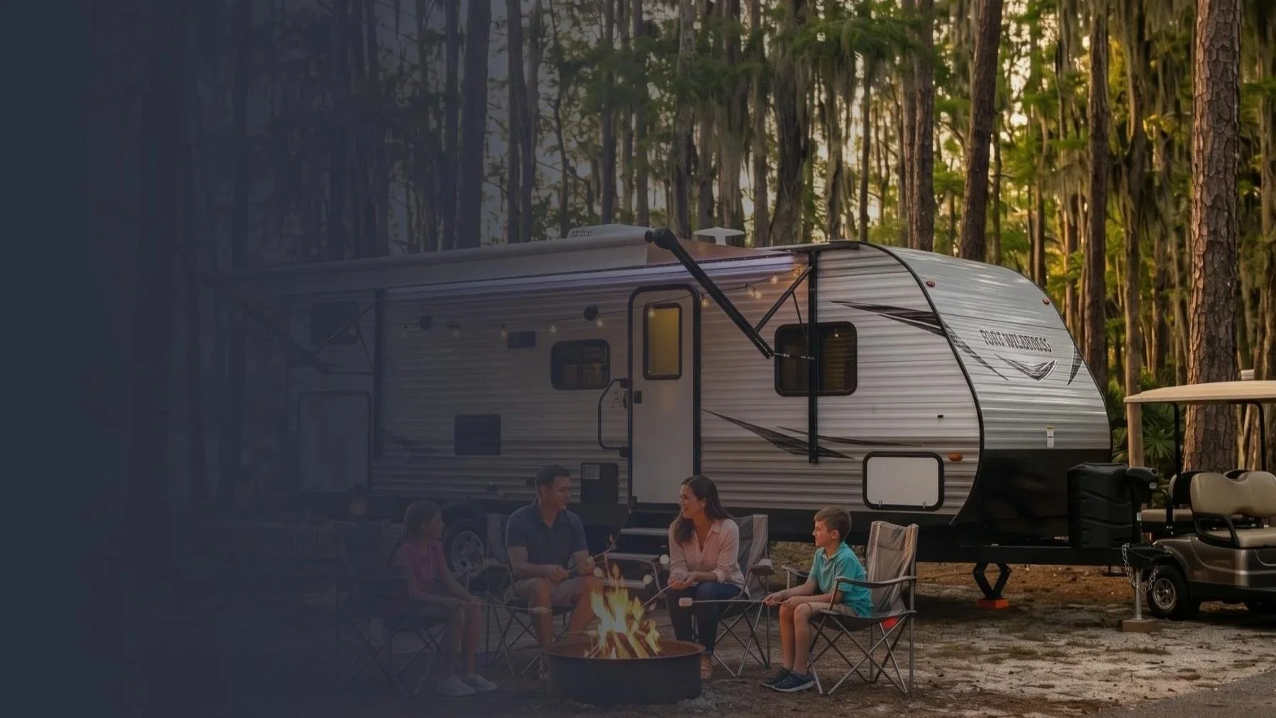 Fort Wilderness, FL campsite near Disney World, with a travel trailer rental and young family.