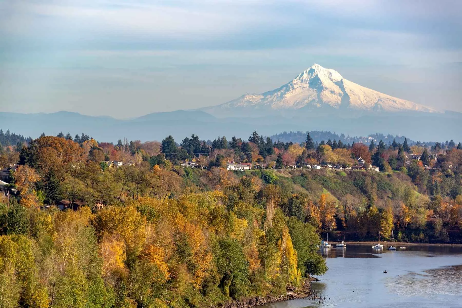 Mount Hood rising above the Willamette River and fall foliage near Portland, Oregon, a top destination for travel trailer rentals.