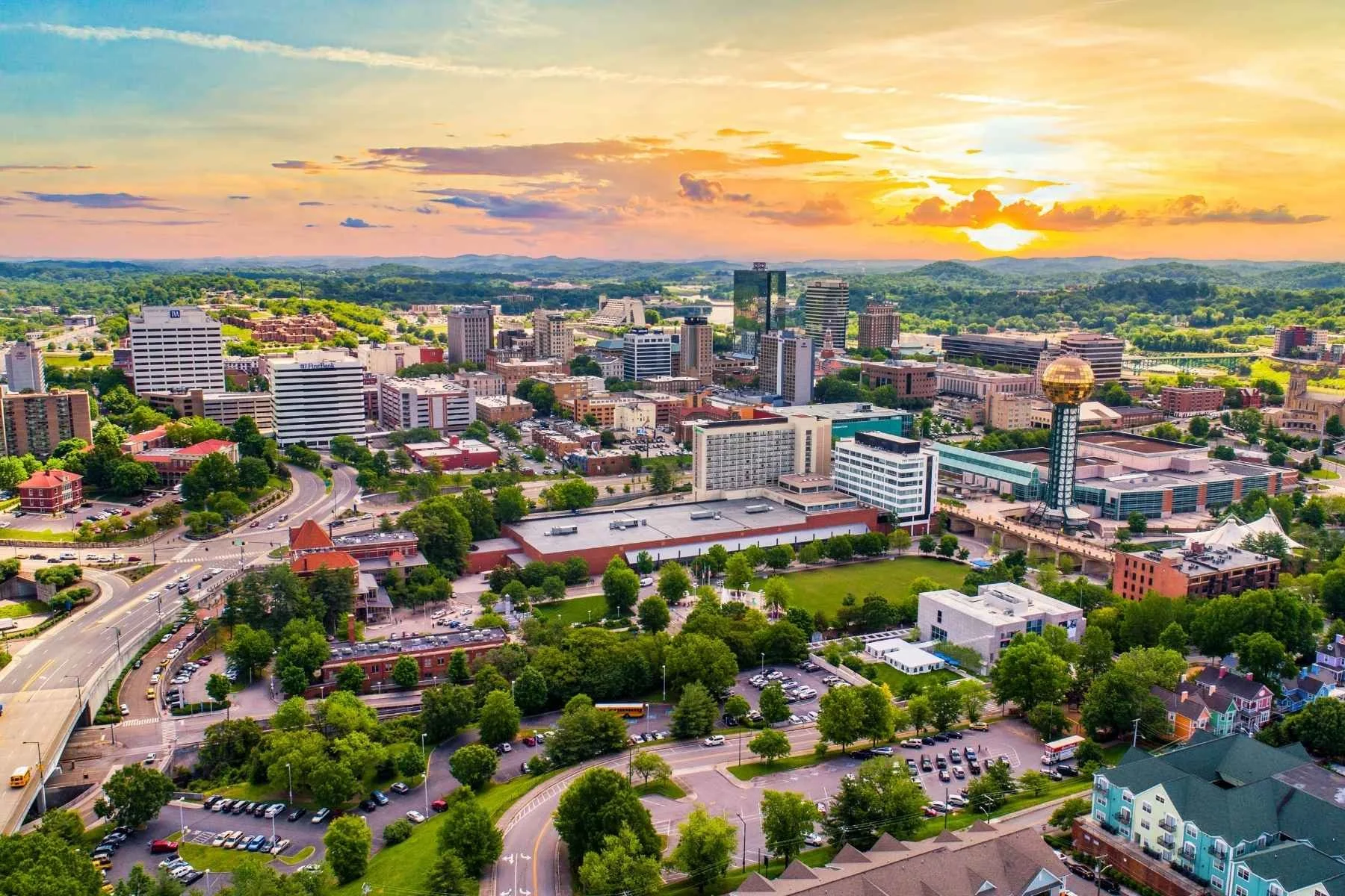 Downtown Knoxville, TN skyline and Sunsphere at sunset, a starting point for travel trailer rentals in East Tennessee