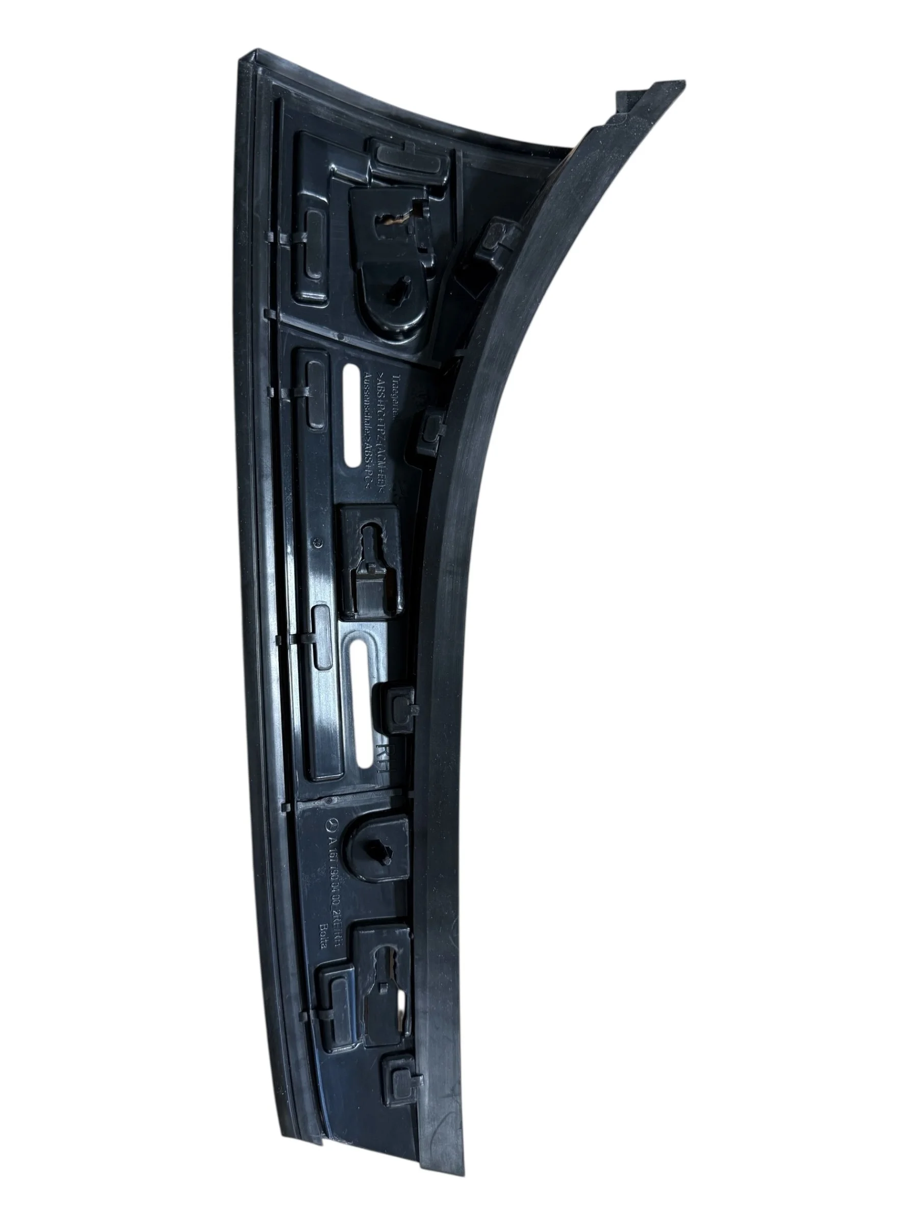 D Pillar Exterior Trim system utilizing a 2 Shot injection molding process with integrated seals and painted surfaces