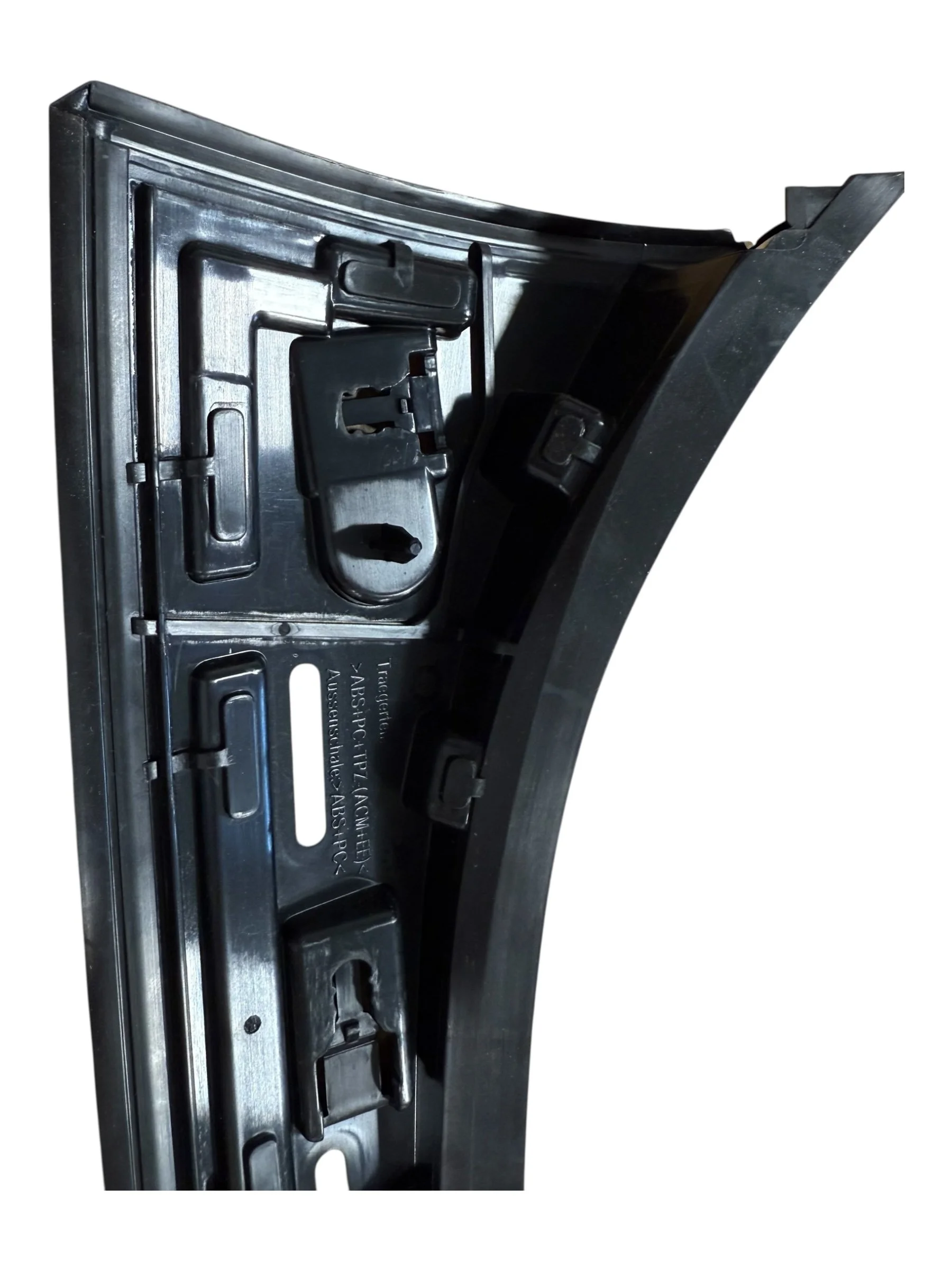 A Pillar Exterior Trim system utilizing a 2 Shot injection molding process with integrated seals and painted surfaces
