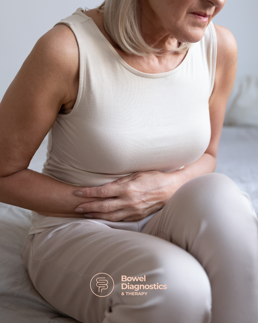 Woman holding belly bloated hurting