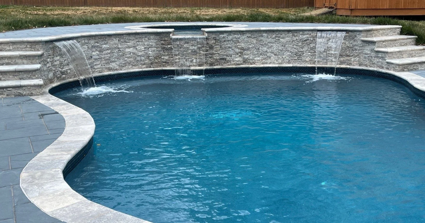 Freeform pool &amp; spa combo with waterfalls in Gaithersburg, MD.