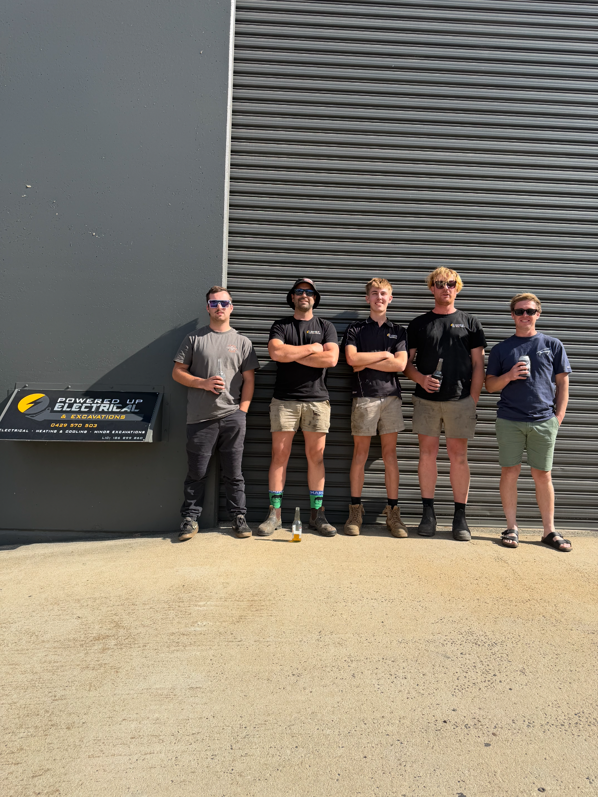 Powered Up Electrical TAS team in front of Launceston workshop