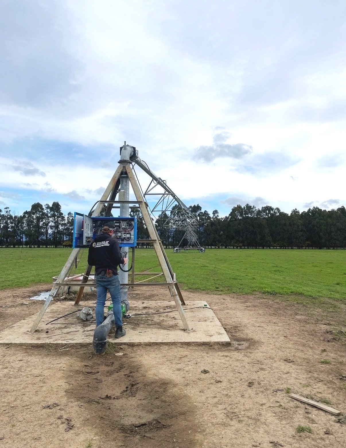 Amos from Powered Up Electrical working on an irrigator