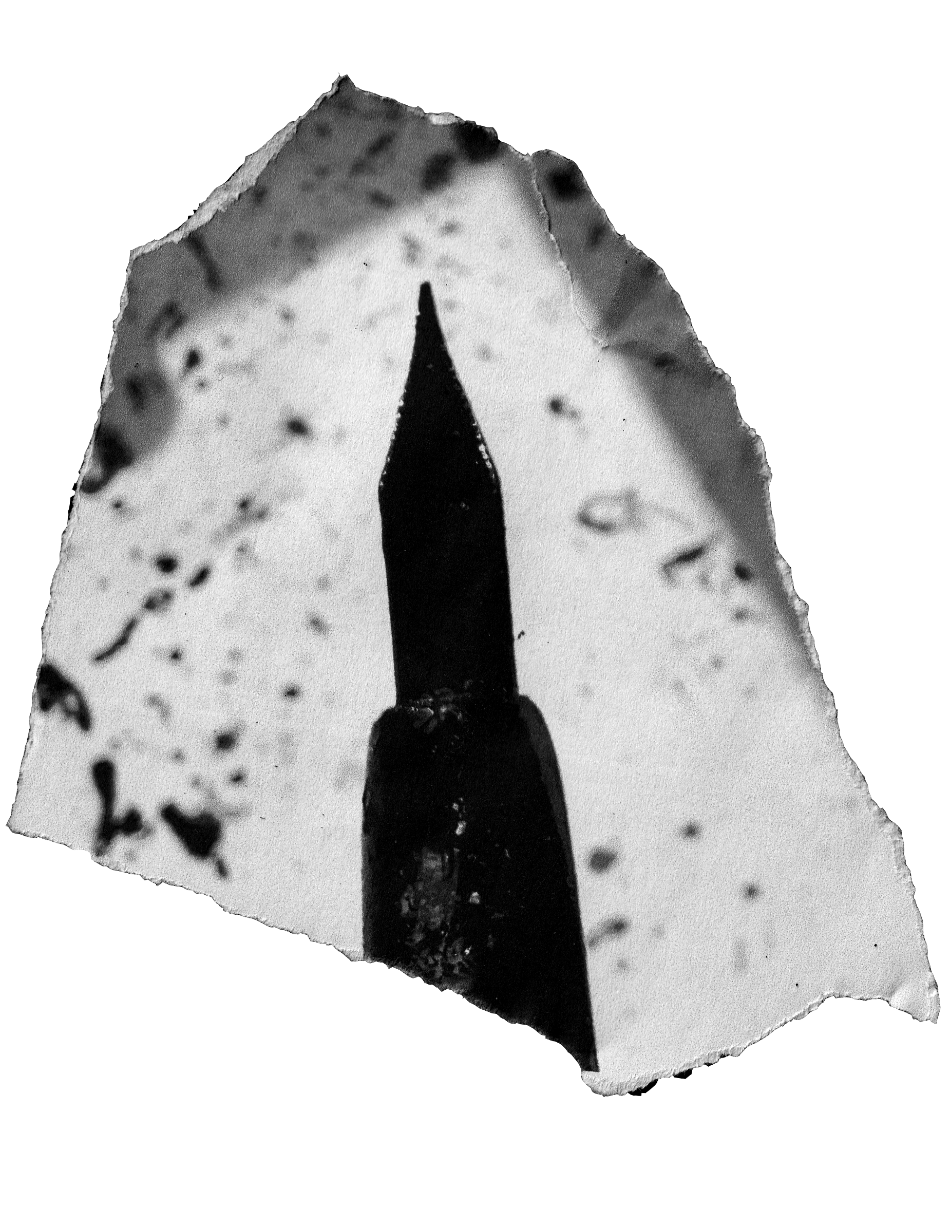 Close-up of a torn piece of paper with a black pen tip illustration, black ink splatters, and a black background.