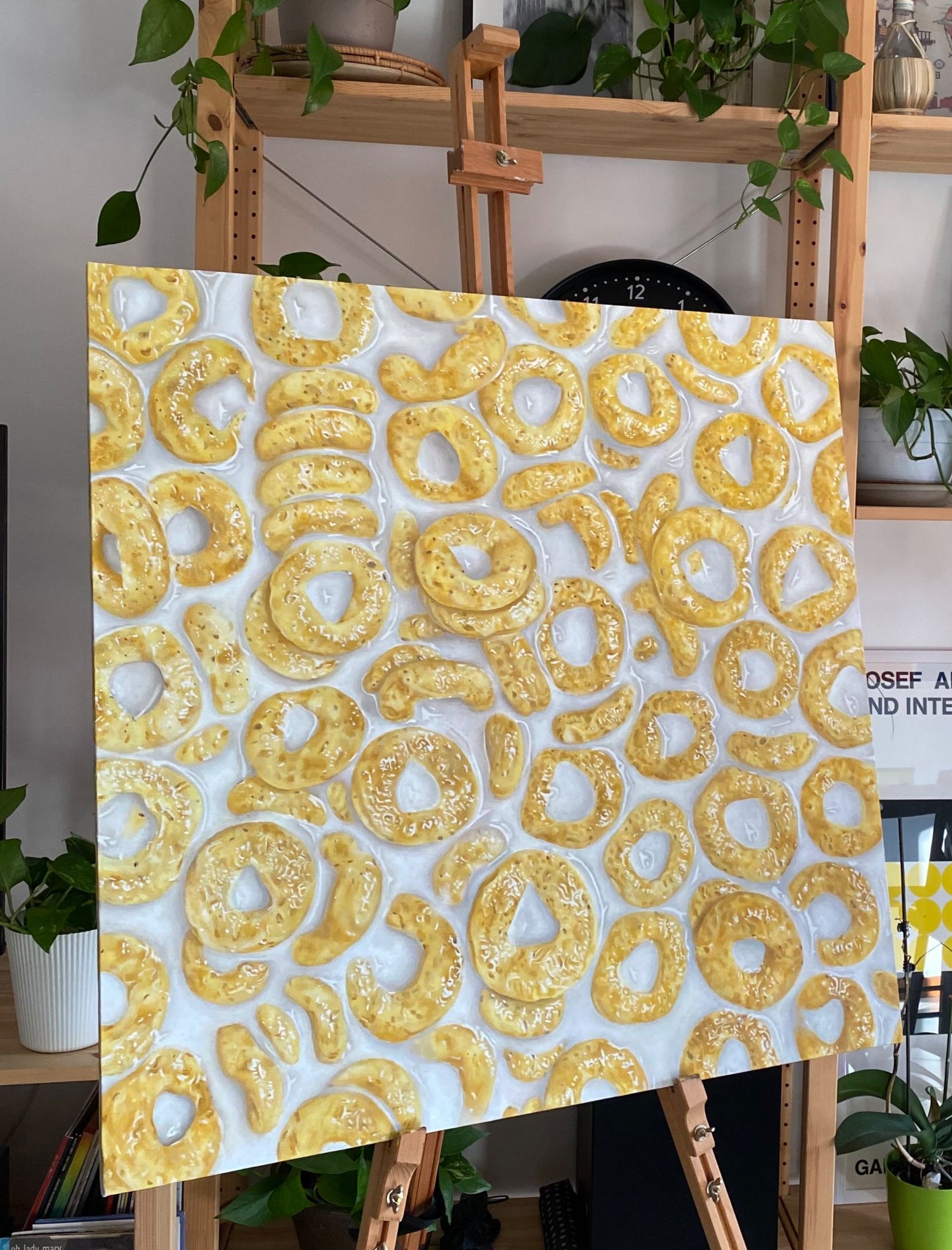 Dipinto di ciambelle rosee e lucide che assomigliano a pretzel in vari formati.