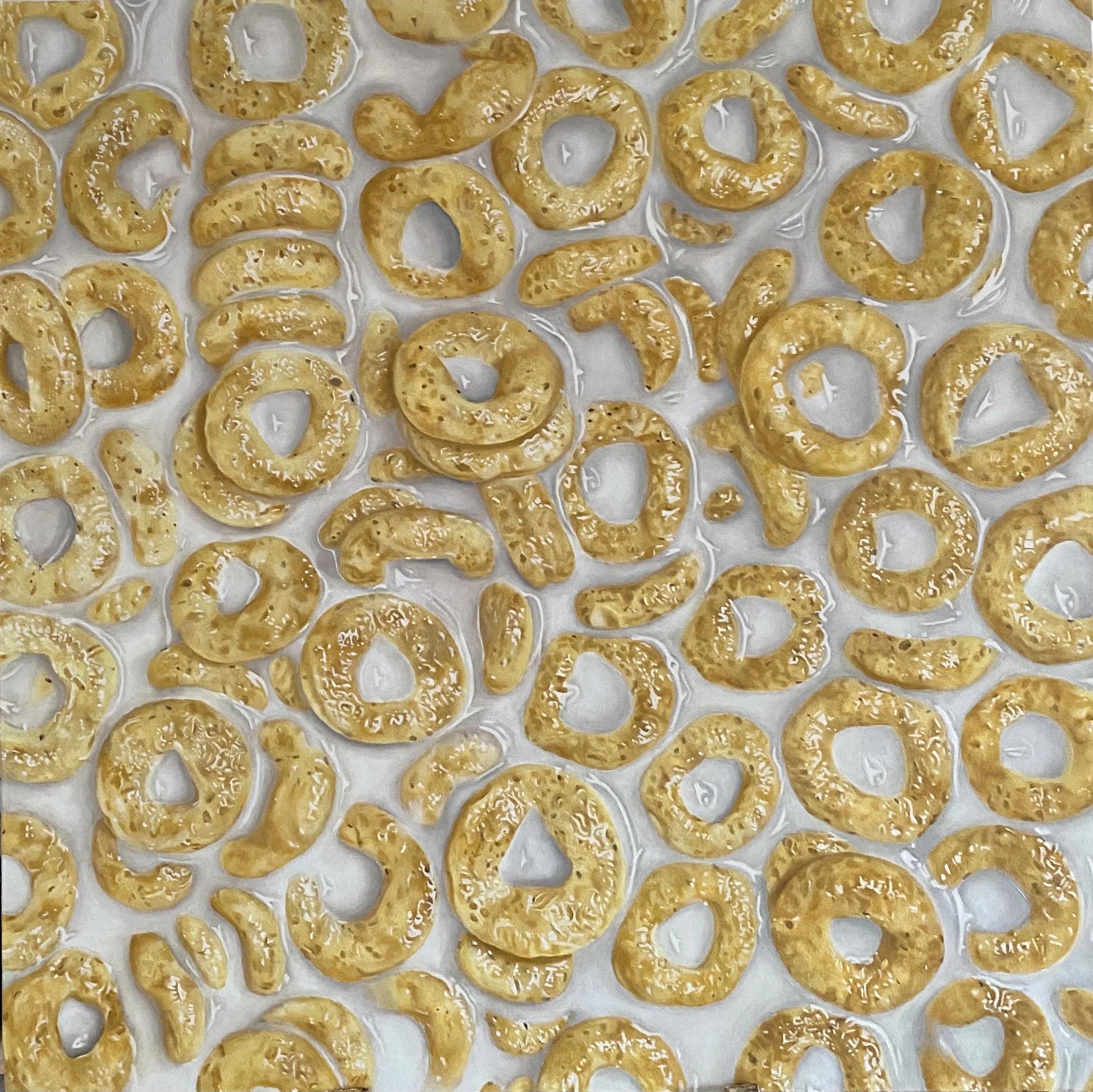 Pretzels dorati disposti su carta da forno.