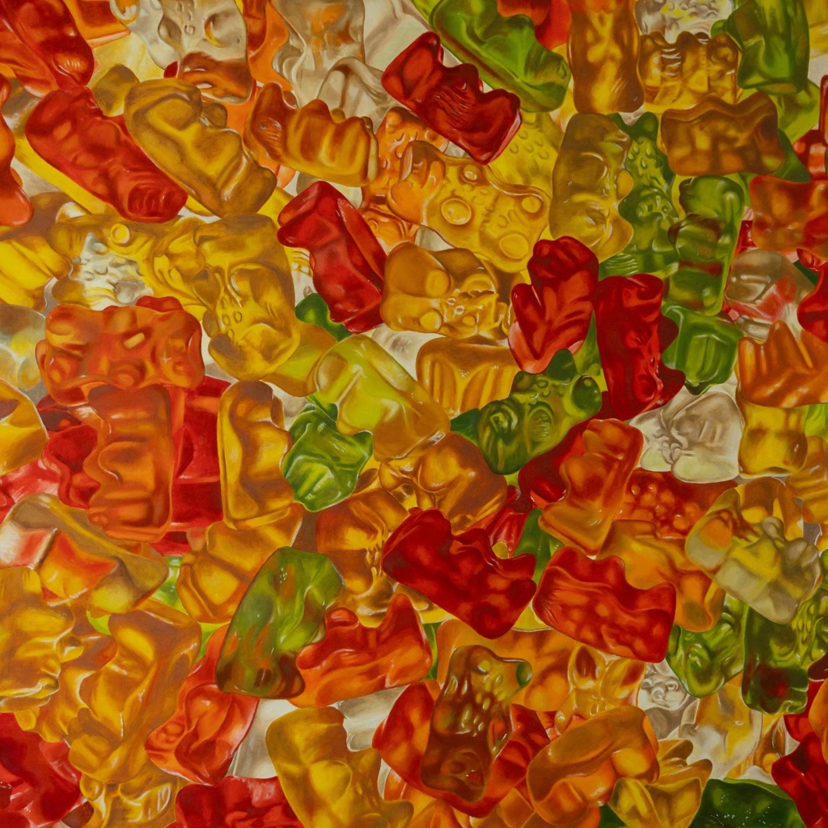 Un mosaico colorato di pezzi di vetro iridescente di varie forme e colori, tra cui rosso, giallo, verde e arancione.