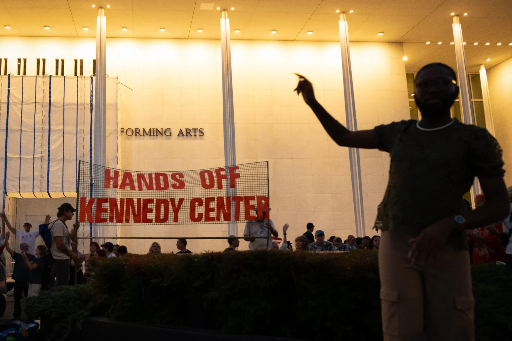 A demonstrator gestures as protesters gather outside the John F. Kennedy Center for the Performing Arts during a rally opposing President Donald Trump’s takeover of the arts center and threats to demolish it, Friday, Sept. 18, 2026.