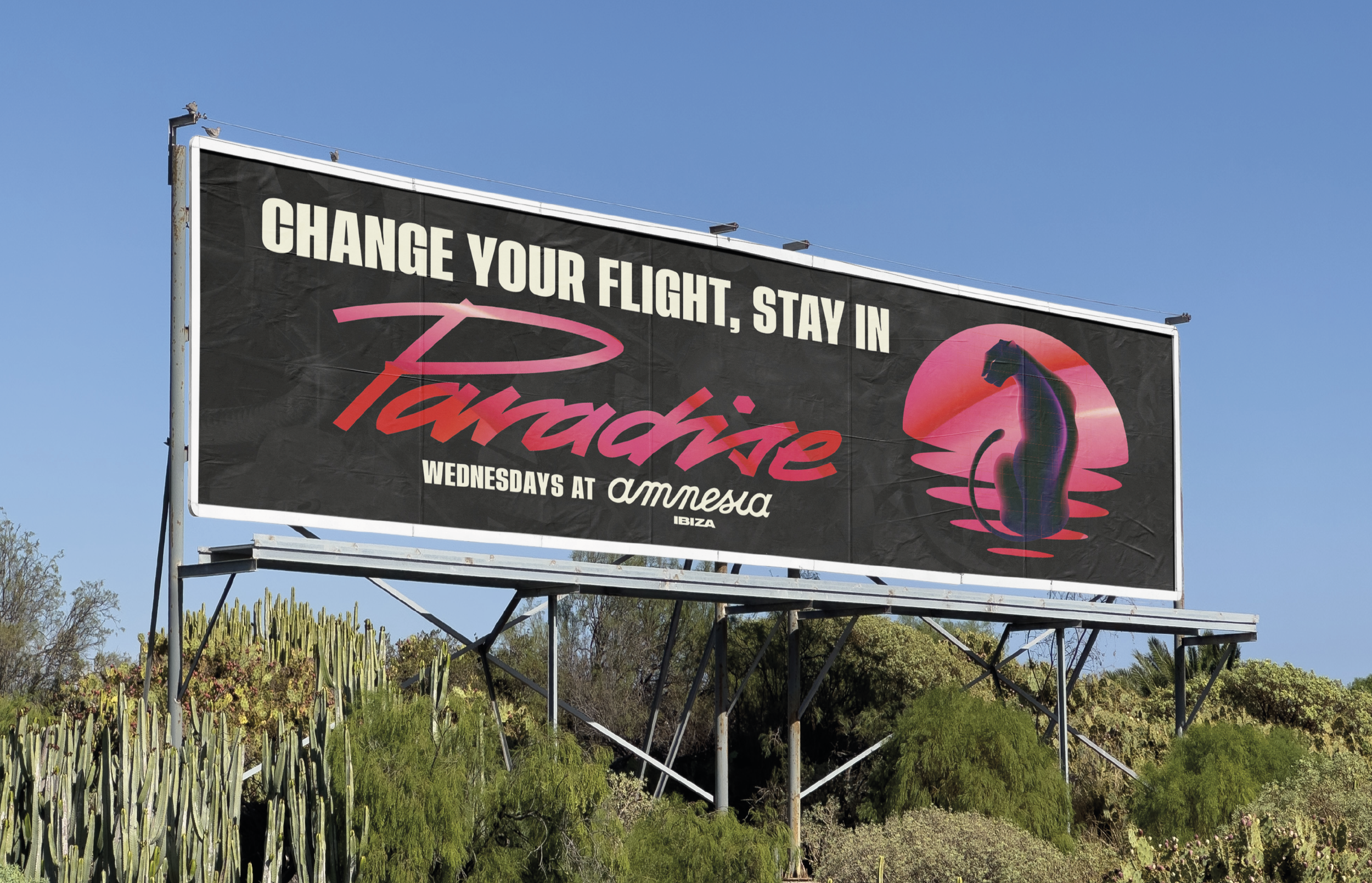 Large motorway billboard in Ibiza promoting Jamie Jones’ Paradise event at Amnesia. The design features bold text reading ‘Change your flight, stay in Paradise’ over a vibrant, colorful graphic with tropical and psychedelic element.