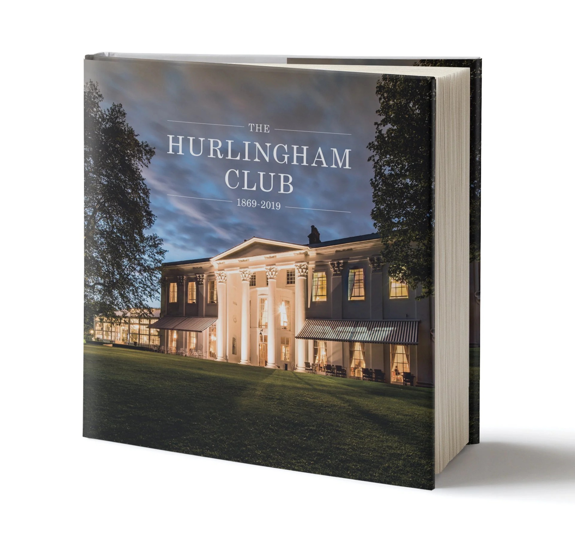 A 150th celebration book for The Hurlingham Club, featuring an elegant photo of the club’s grounds on the cover with the text “The Hurlingham Club, 1869 – 2019.”