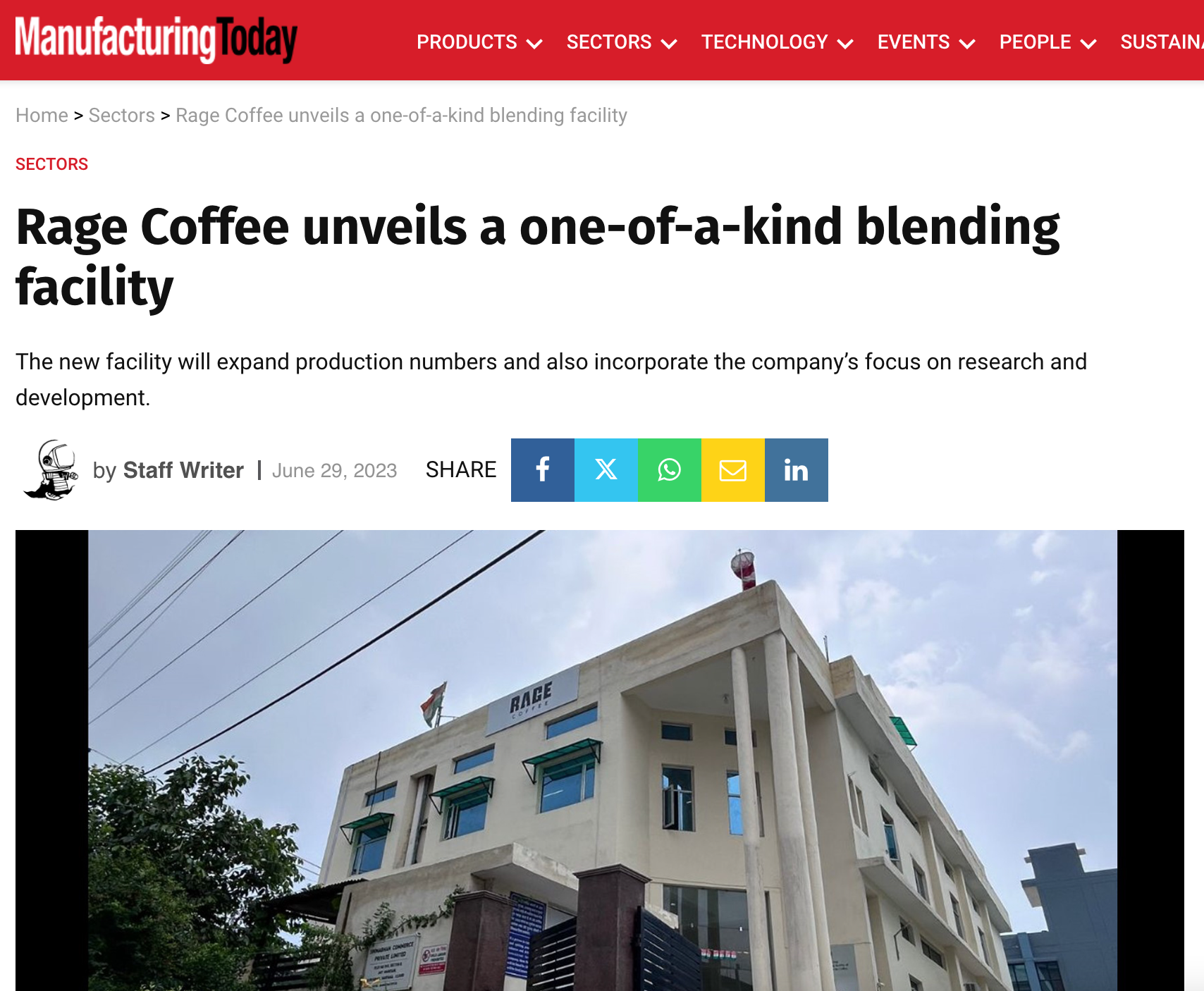 Photo of a white multi-story building with a sign that reads "RAGE" at the top, under a partly cloudy sky.