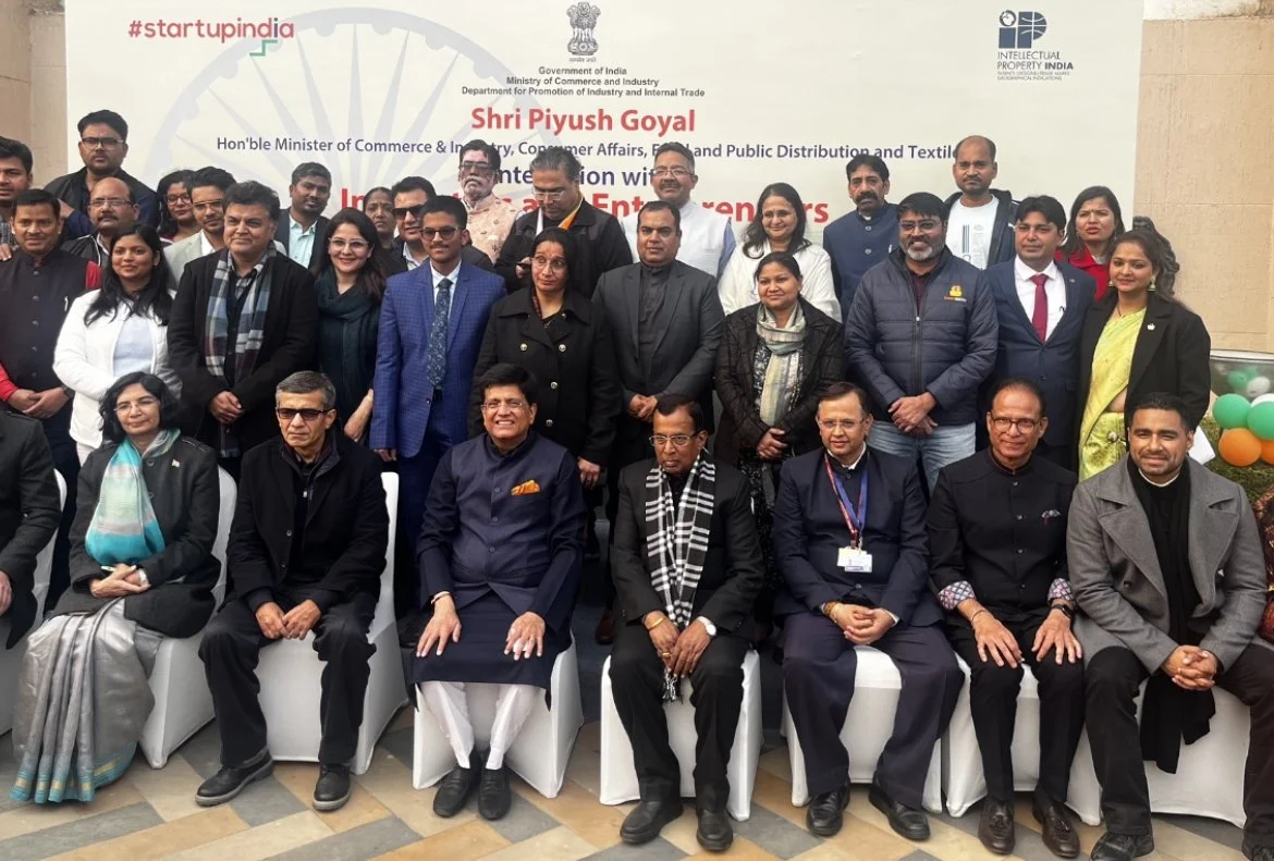 Group photo of officials and dignitaries at a government event in India, with a banner in the background mentioning Shri Piyush Goyal and the Department for Promotion of Industry and Internal Trade.