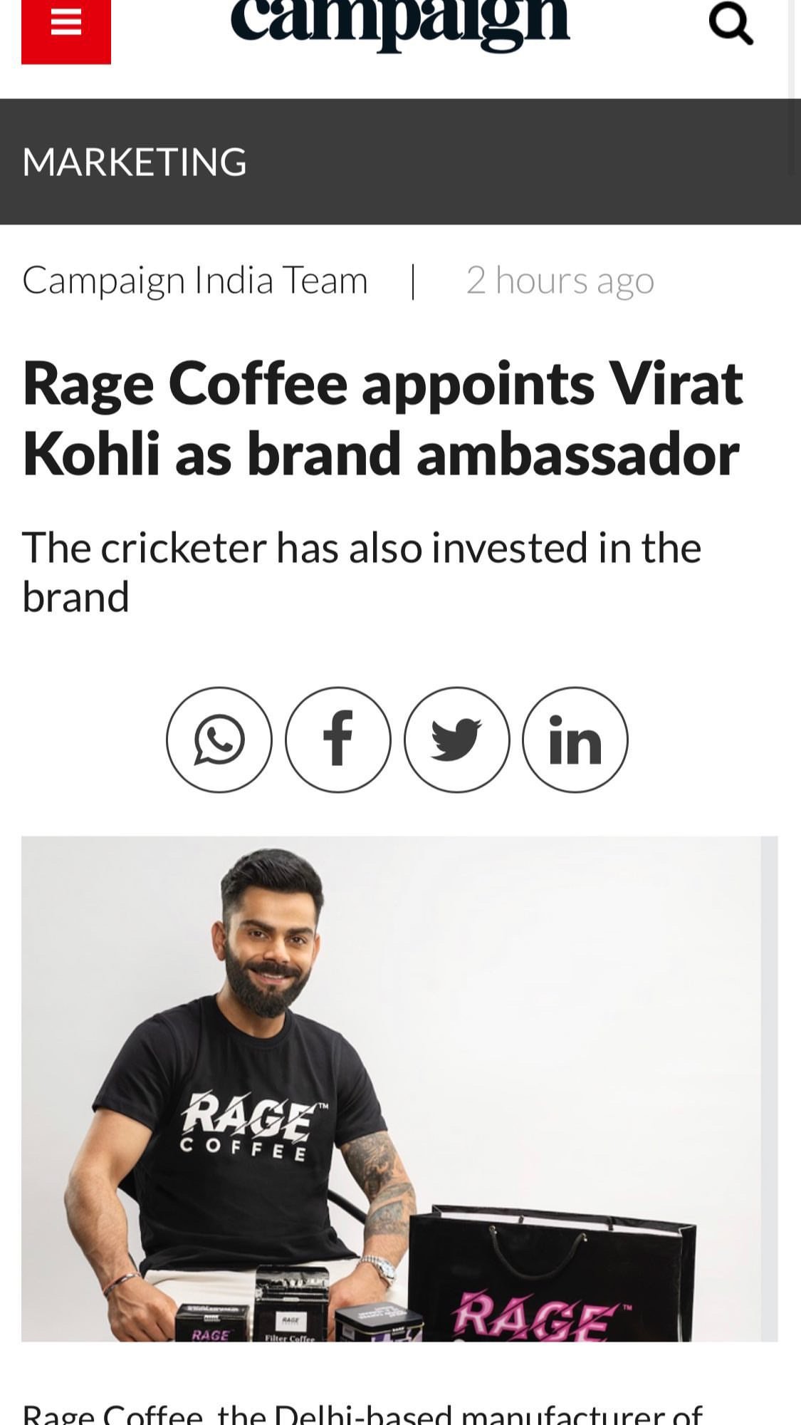 A man with a beard and tattooed arm, wearing a black Rage Coffee t-shirt, is sitting with a smile. In front of him are Rage Coffee products, including coffee packets and a shopping bag with Rage's logo.