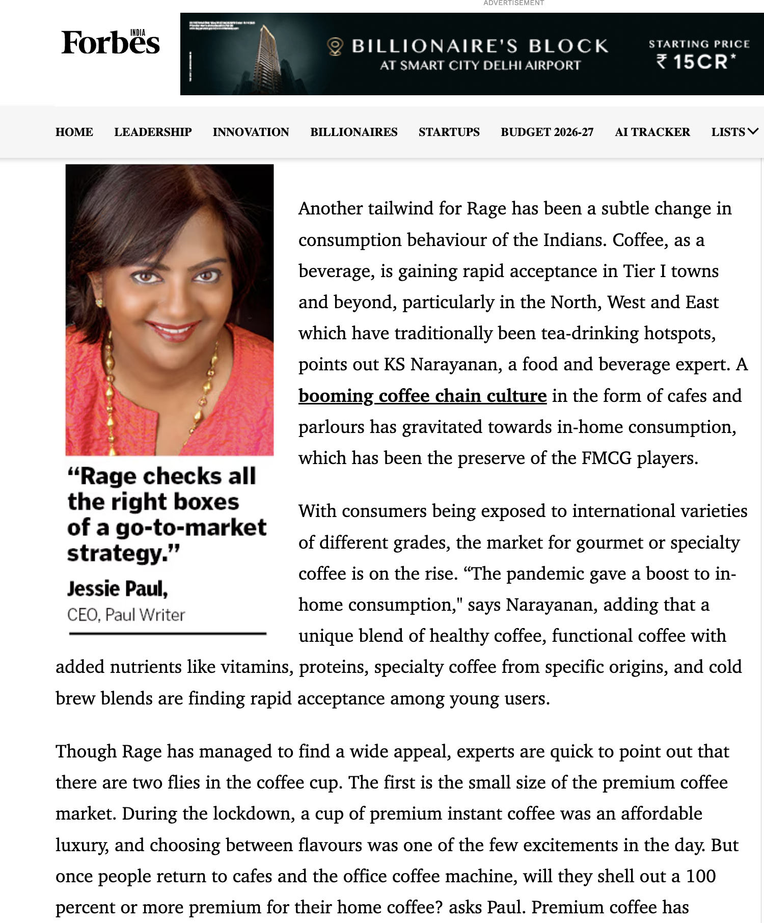 A woman with short black hair, dressed in a pink top, smiling in a professional headshot for an article about coffee culture.