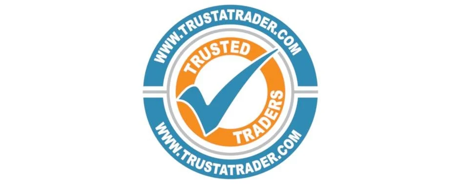 Seal with blue, white, and orange colors, featuring a checkmark and the words "Trusted Traders" and website URL www.trustatrader.com
