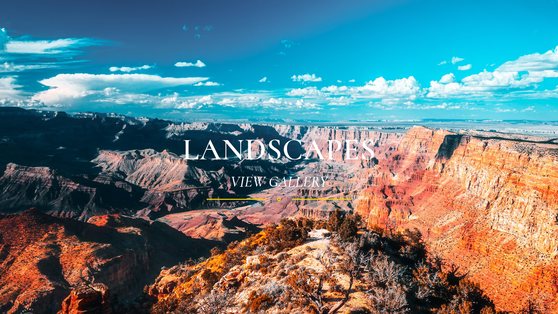 Landschaft des Grand Canyon mit blauer Himmel und Wolken, Überschrift 'Landschaften', Unterüberschrift 'View Gallery'
