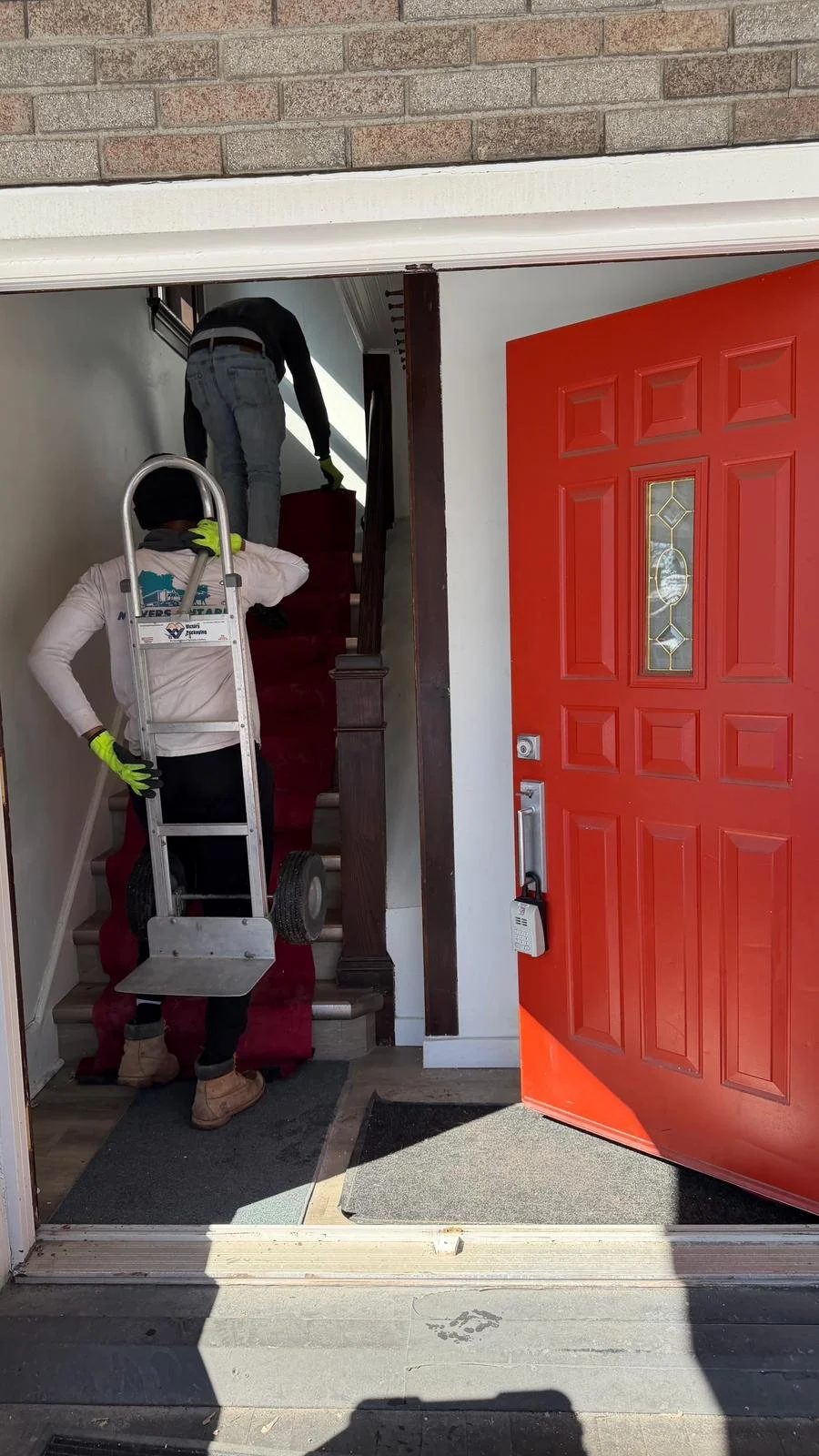 Professional movers carrying furniture during a home move in St. Jacobs Ontario