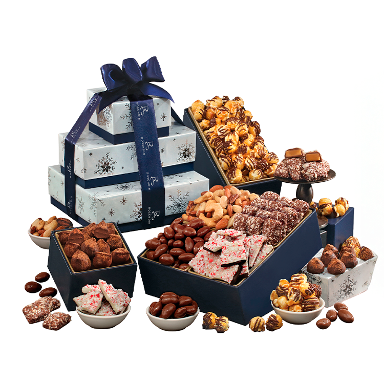 Holiday gift boxes and various chocolates and candies, including caramel clusters, chocolate-covered nuts, and peppermint bark, arranged for a festive display.