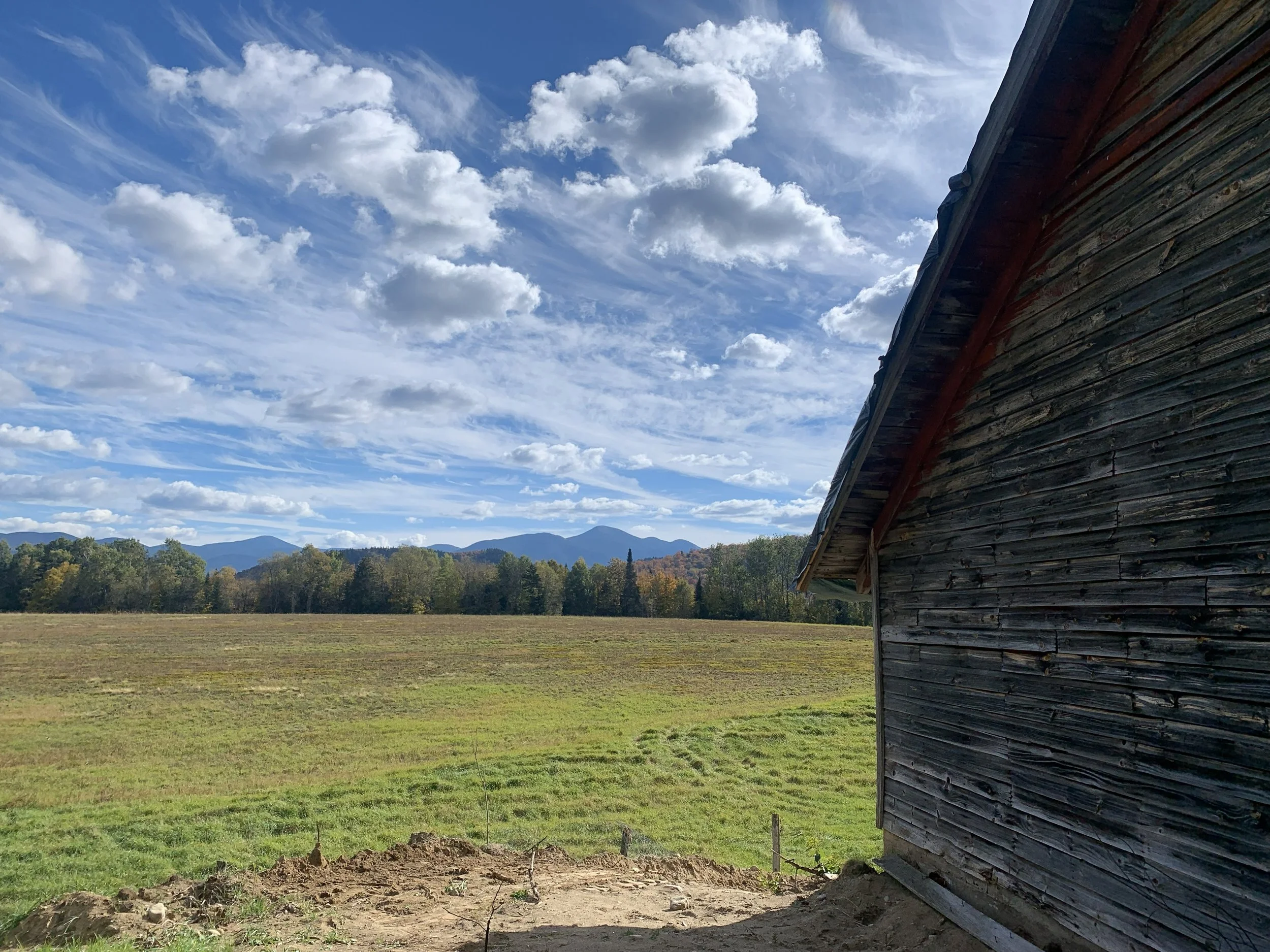 Corner of Red barn with clouds.jpg