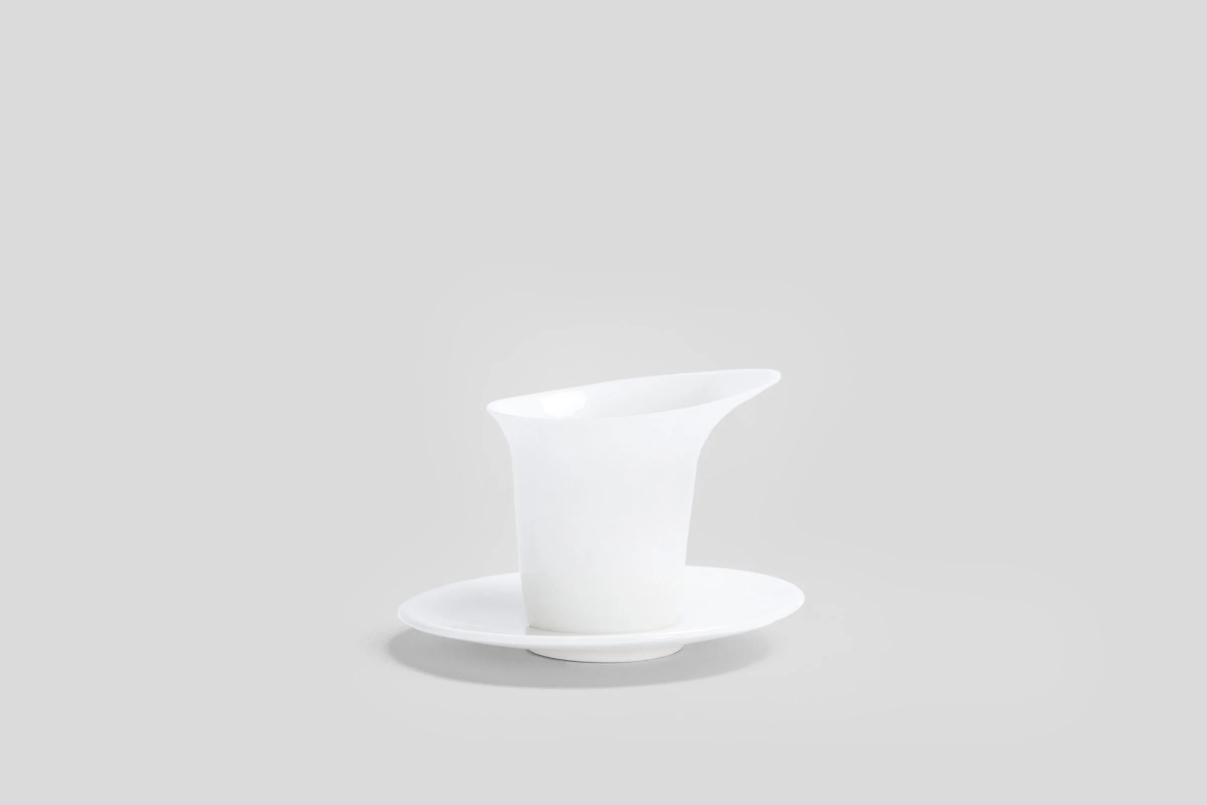 bodo_sperlein_white_sculptural_luna_mug_saucer_2_copy_86971108-512a-4b78-9a5b-baec578c975a.jpg