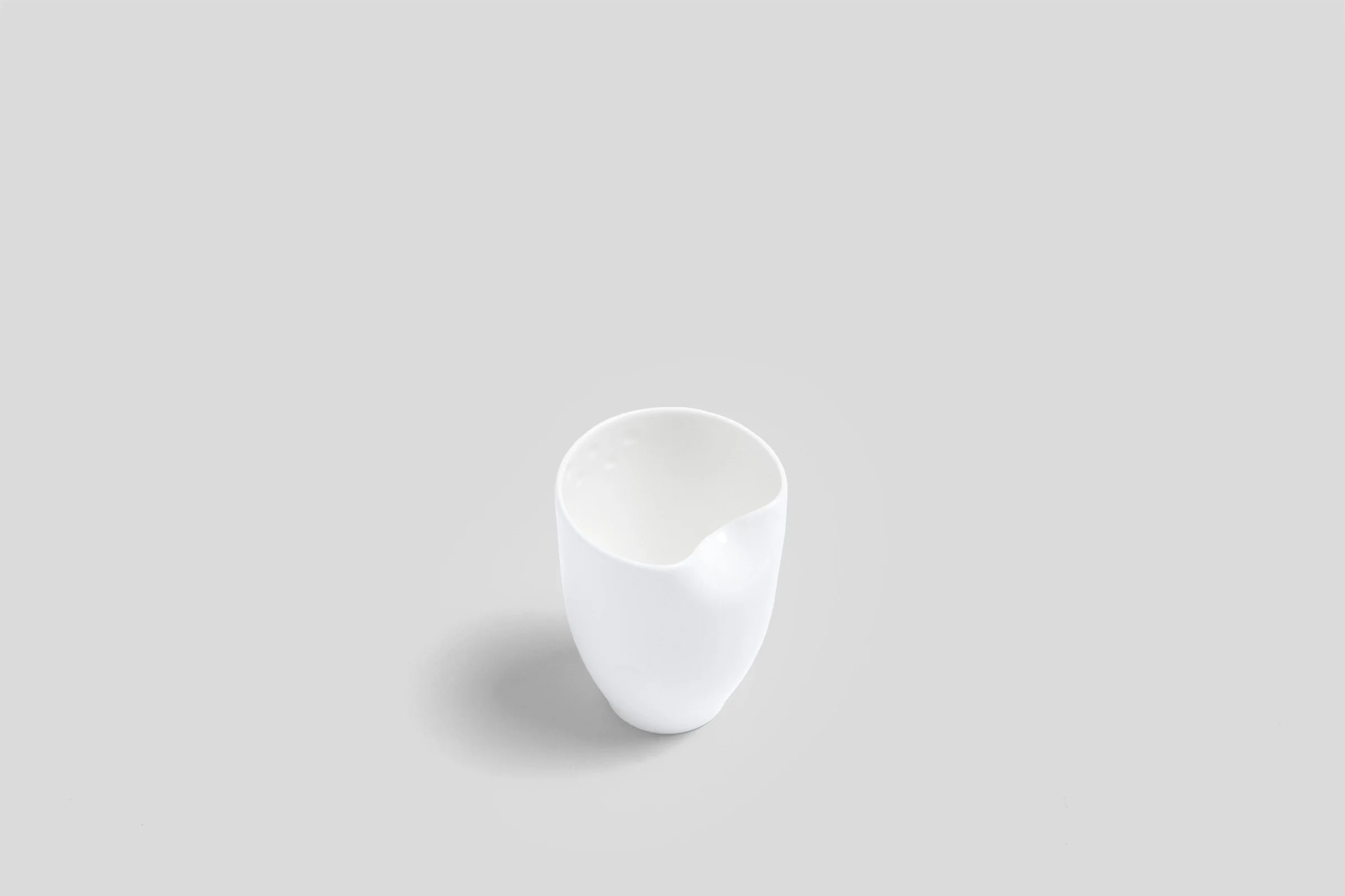 bodo_sperlein_white_sculptural_beaker_dented_1.jpg