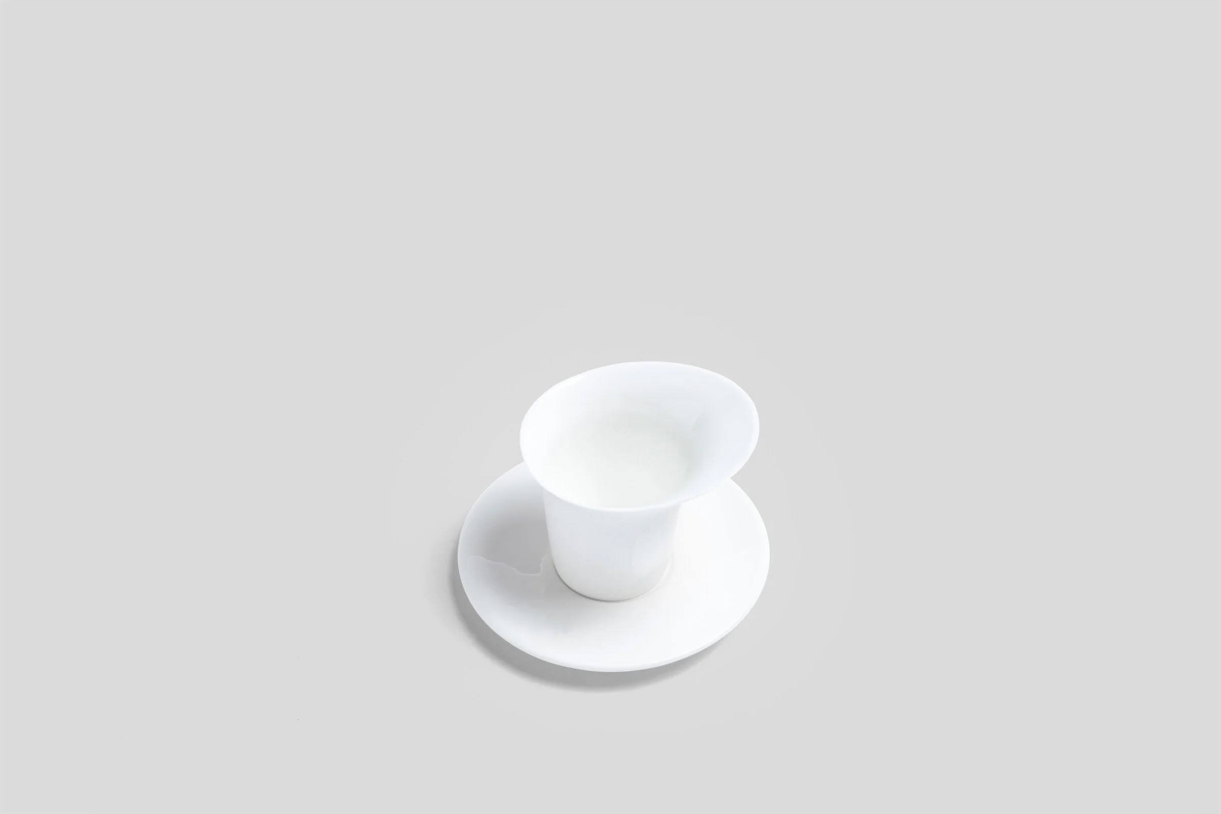 bodo_sperlein_white_sculptural_luna_mug_saucer_1_5128b079-aa72-46c7-96ba-2f58f53b73ed.jpg
