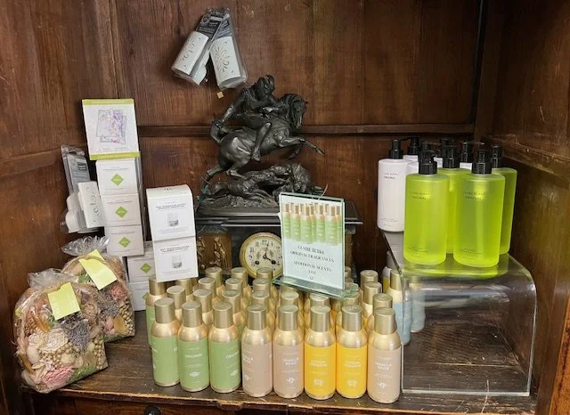 Assortment of Claire Burke fragrances, room sachets, and room sprays.