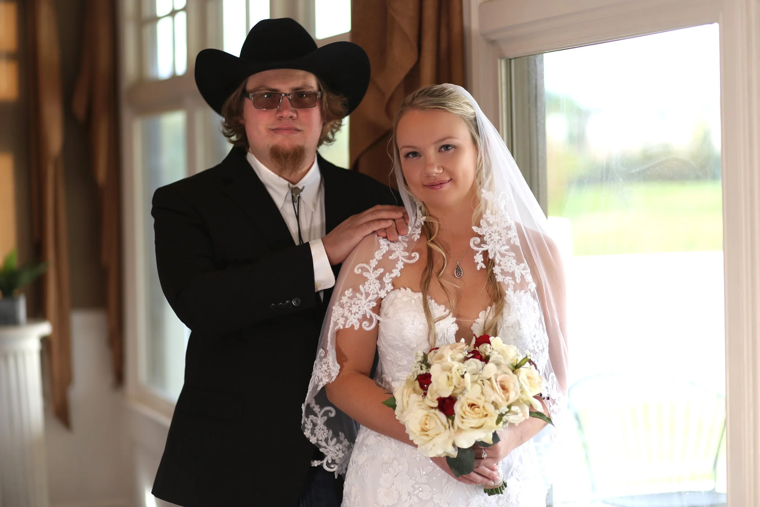 bride and groom at the window.jpg