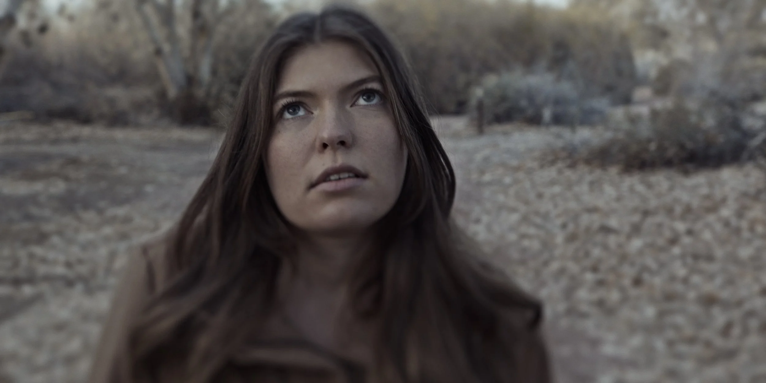A woman walking outside in scene from "Ticking"