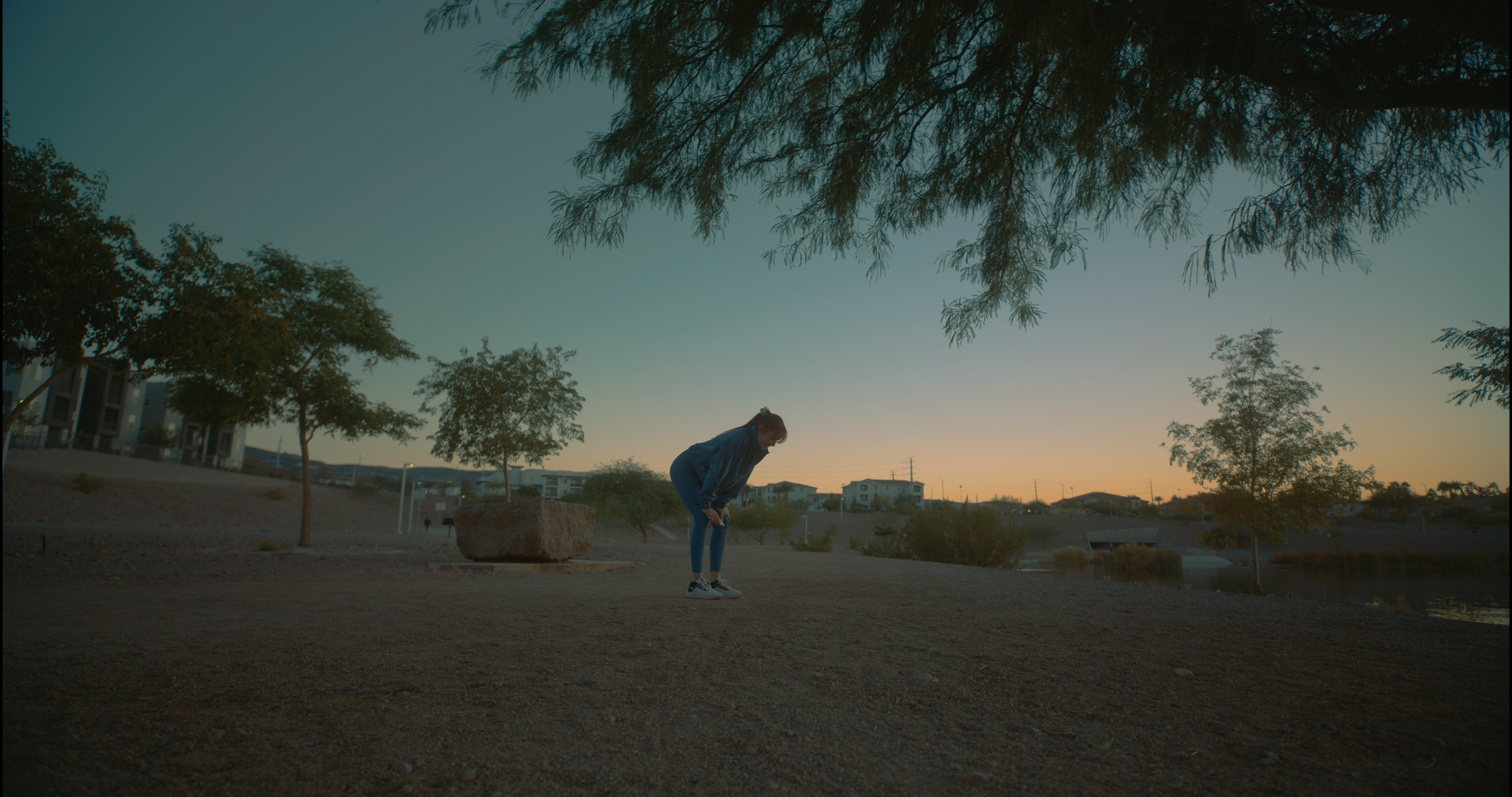 Woman bent over during run in Nike spec ad