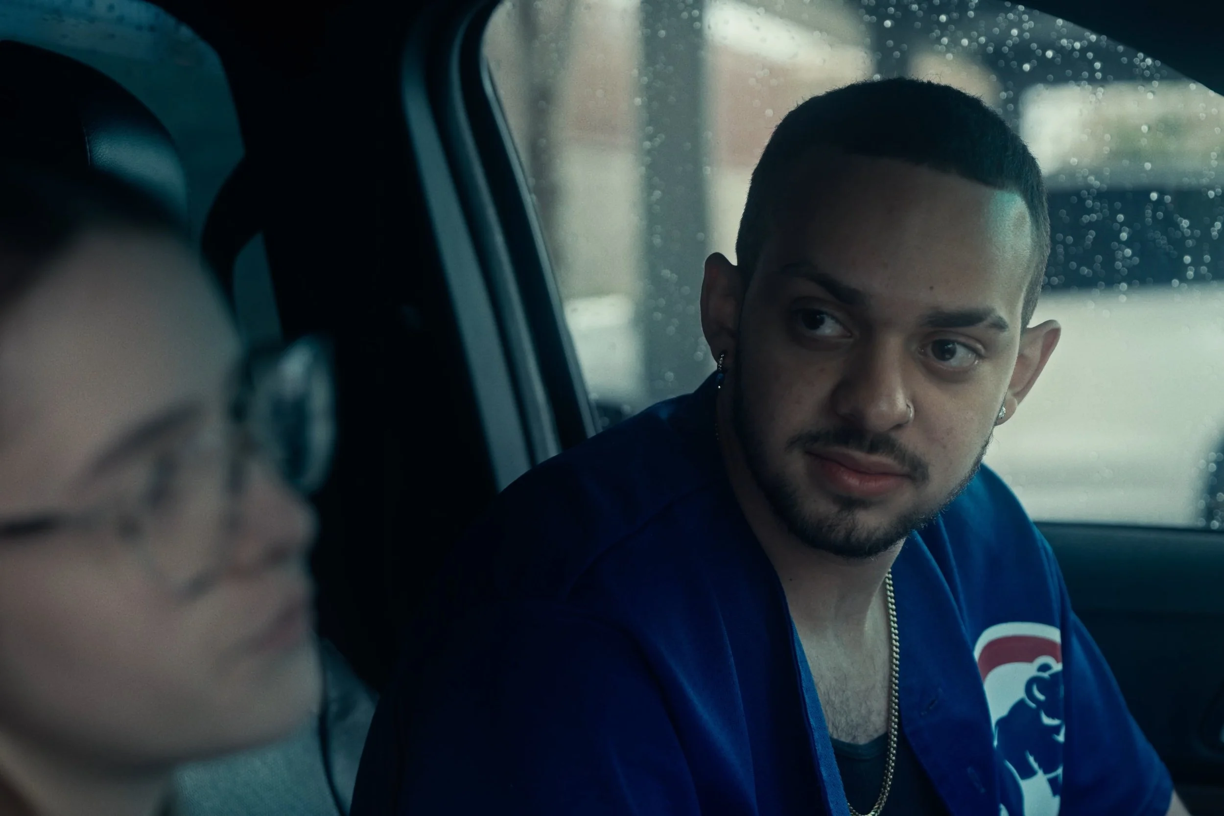 Close up of man in car scene from Something Good