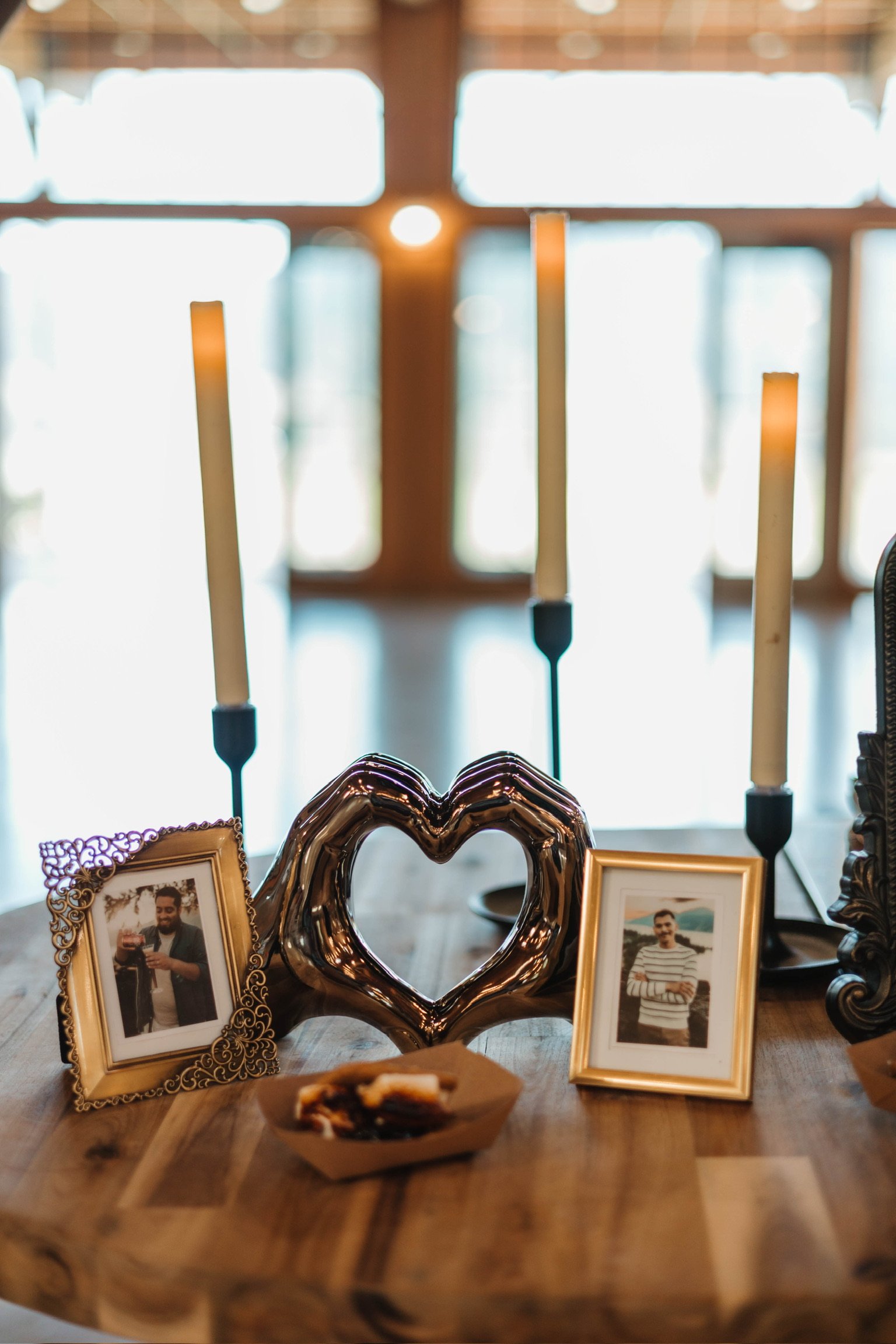 Heart hands - included
Pictures of couple - included, just provide the pictures ahead of time for print.
Faux candle/candle stands - included
