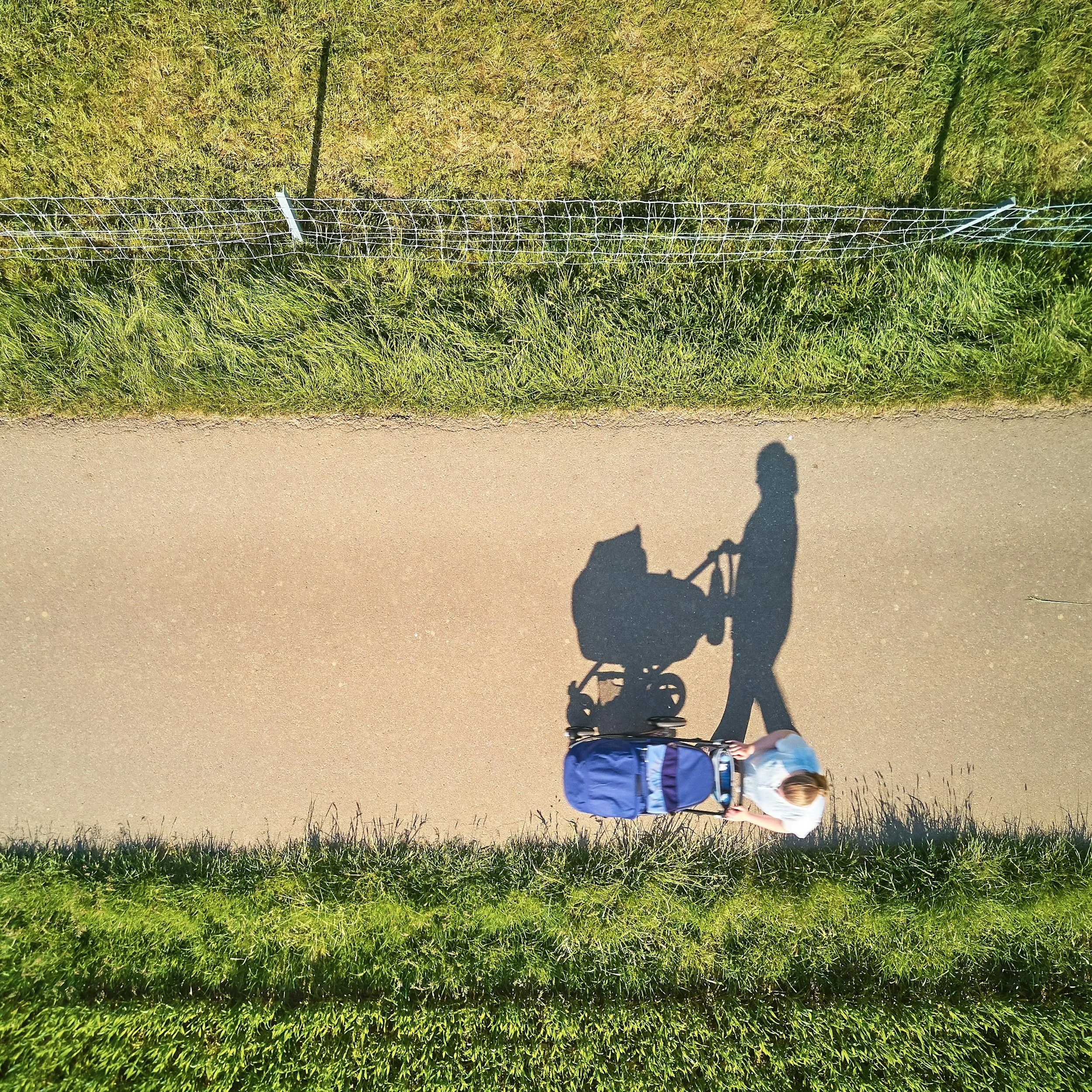 Mother walking with baby in the park - mortgage decisions