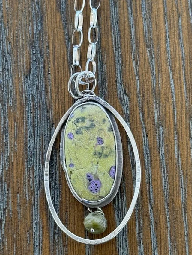 Atlantisite on Silver