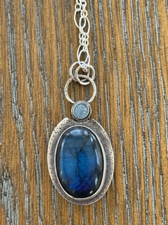Labadorite on textured silver with a 5mm aquamarine.