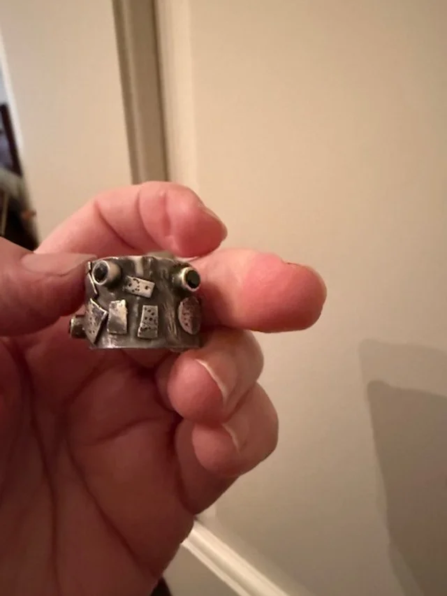 Silver textured and Fused Ring with 3 3mm black Onyx Stones.