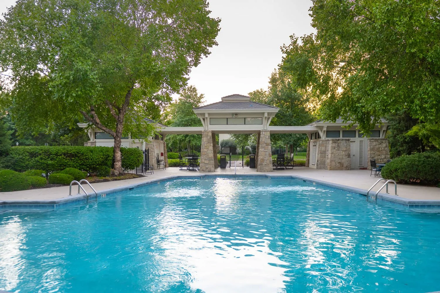 Luxury Overland Park home with a resort-style pool ideal for families relocating to Kansas City.
