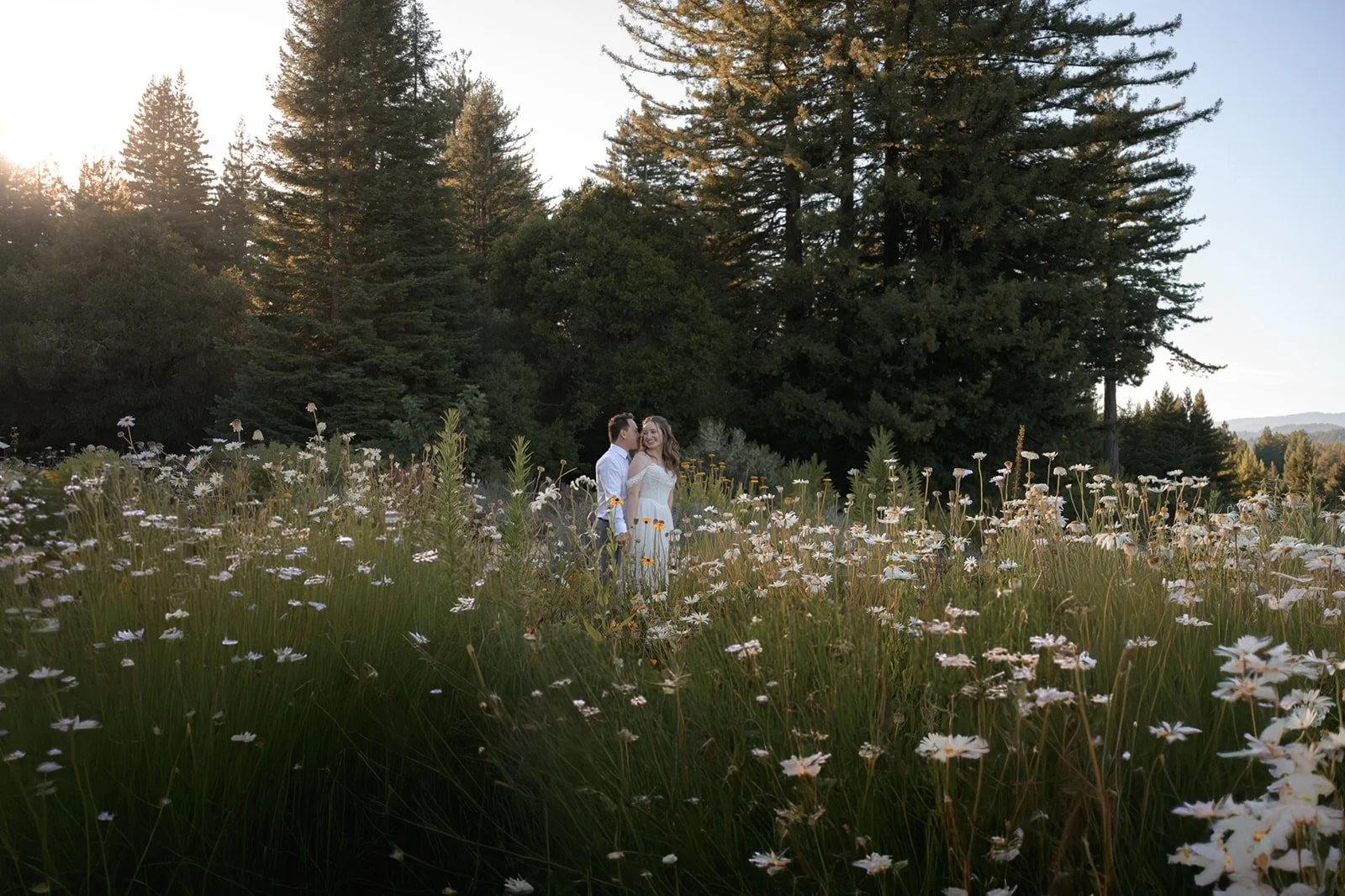 a bride and groom in a garden at Sydalyn Hill wedding venue on their wedding day at sunset