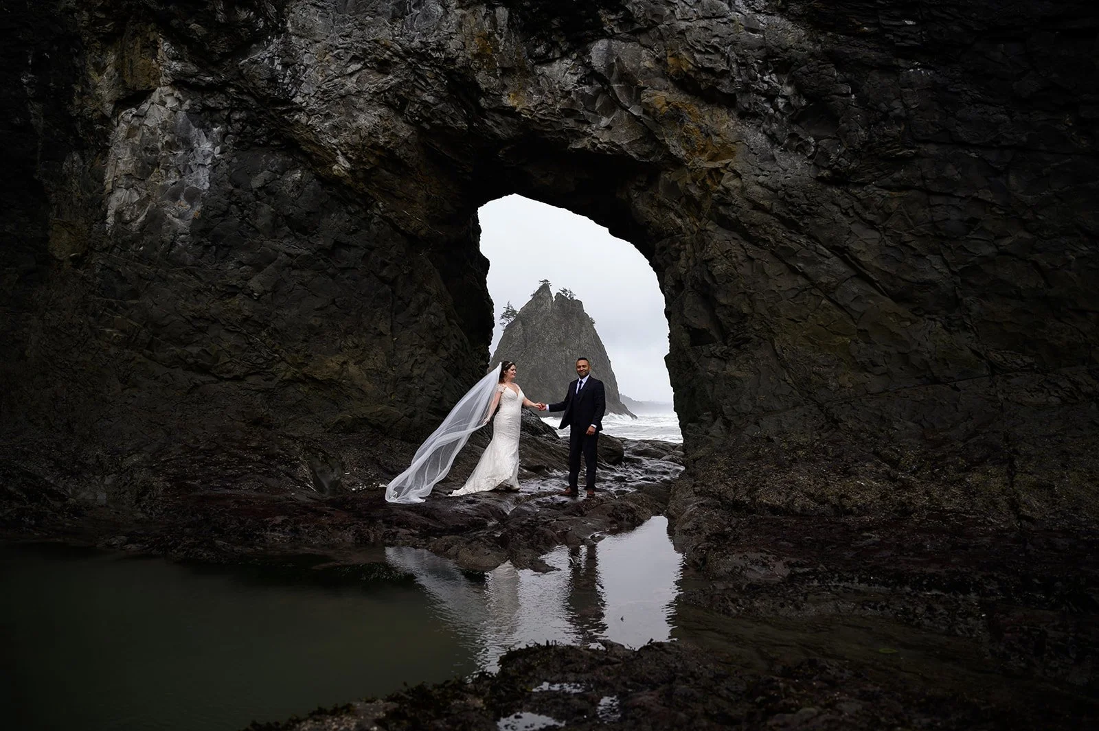 an adventure elopement with a bride and groom at a beach in Olympic National Park